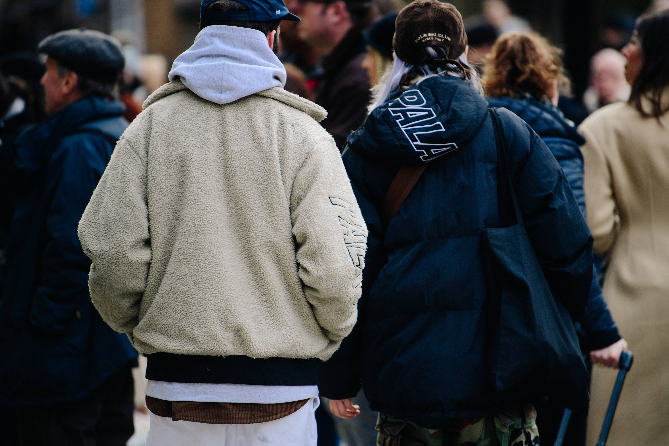 Couple wearing Palace jackets