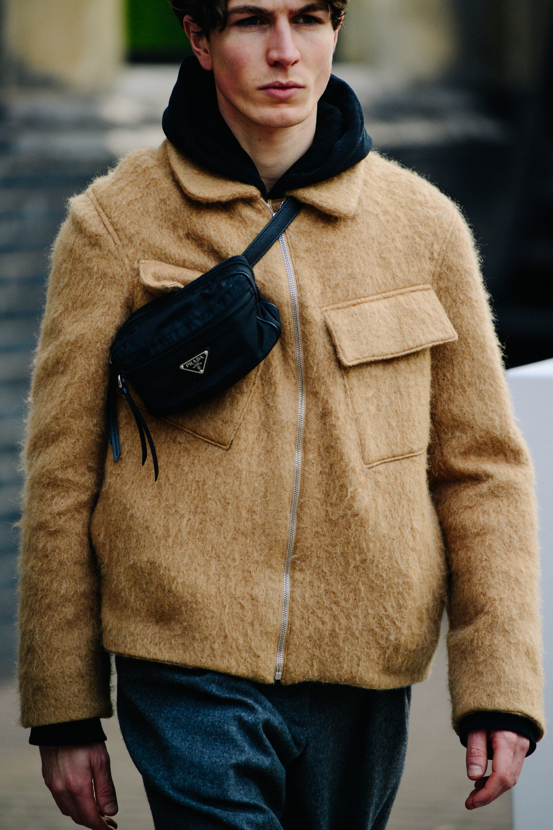 Man wearing Prada bag