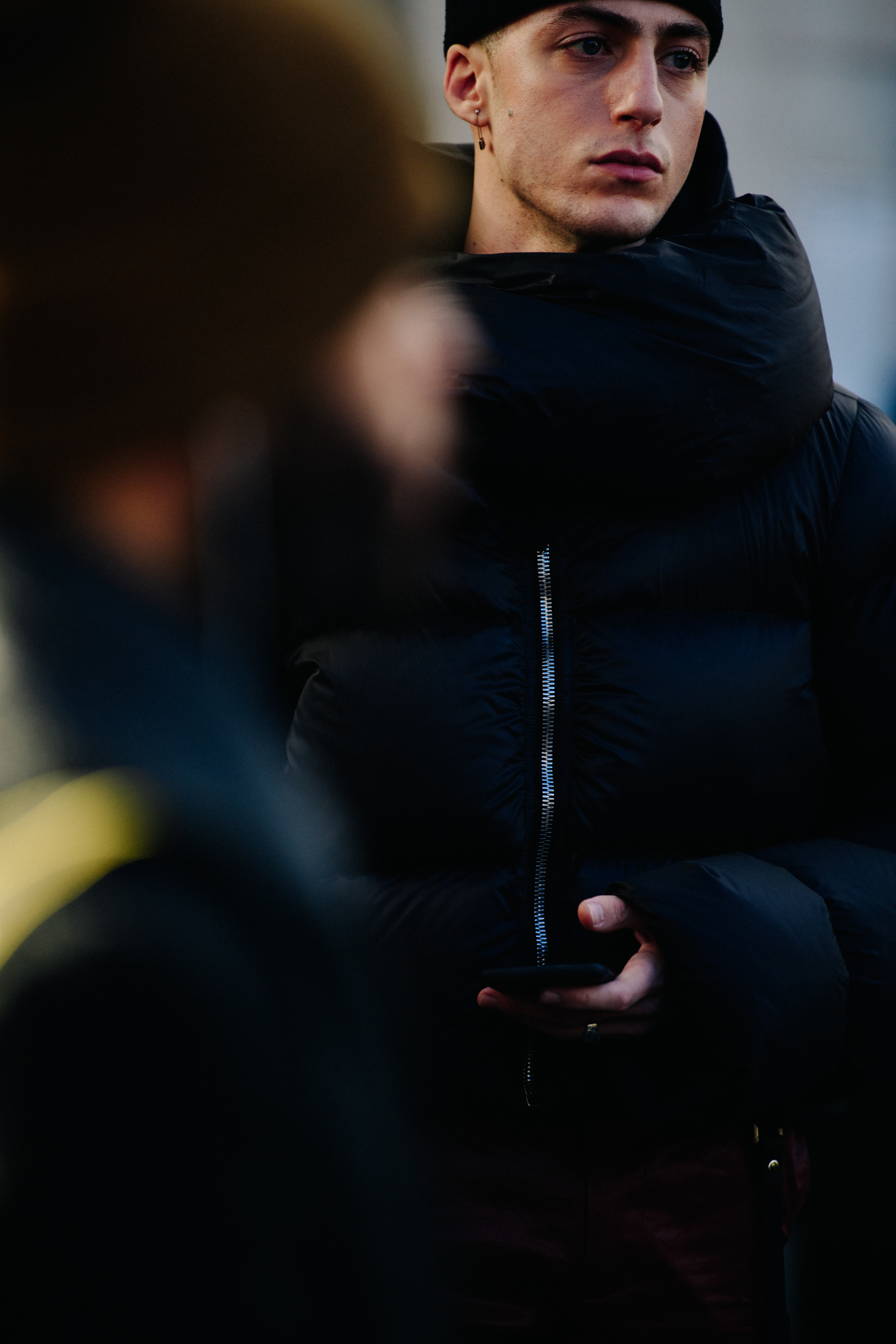 Man wearing black puffer coat