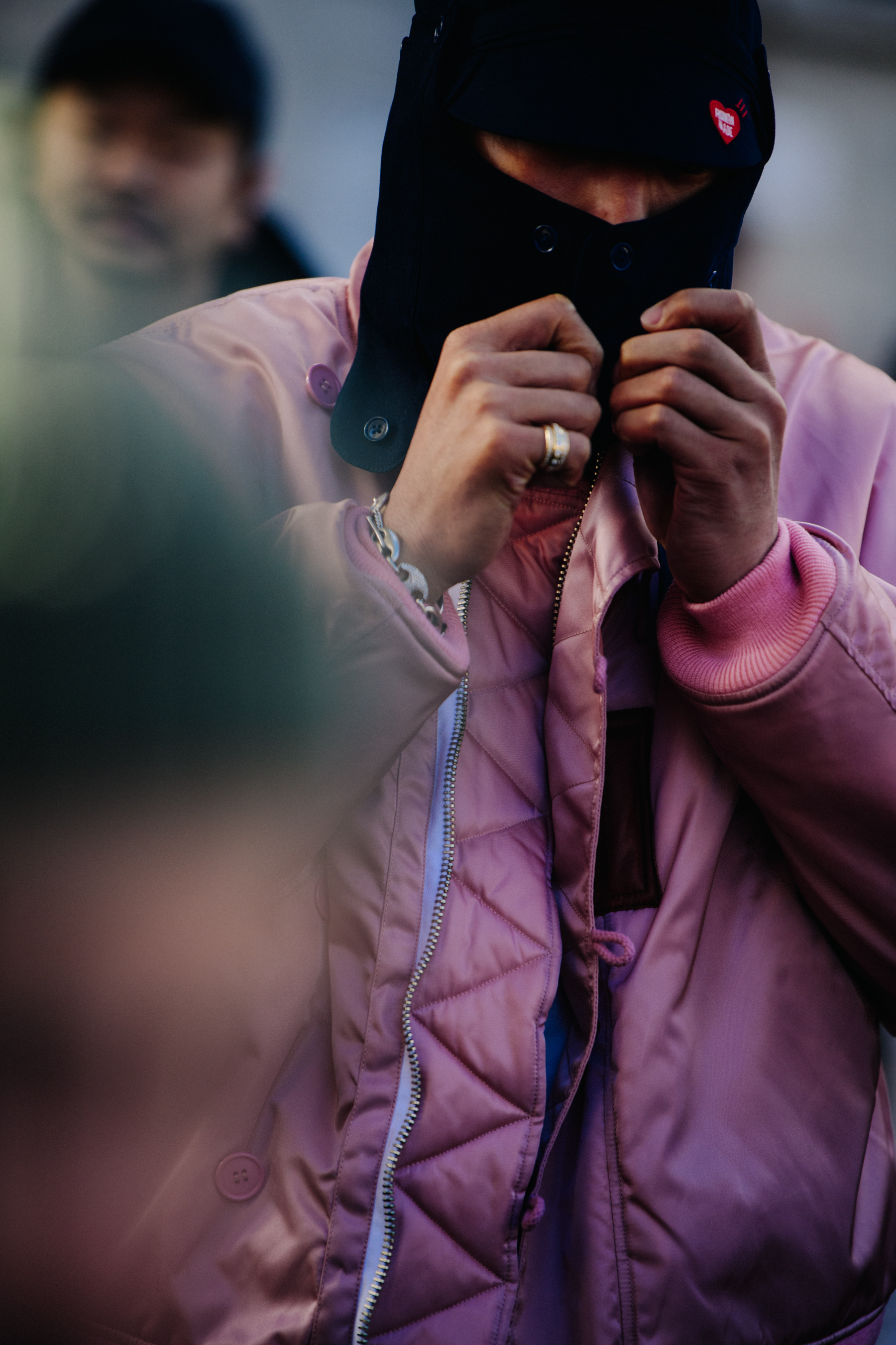 Man wearing pink coat