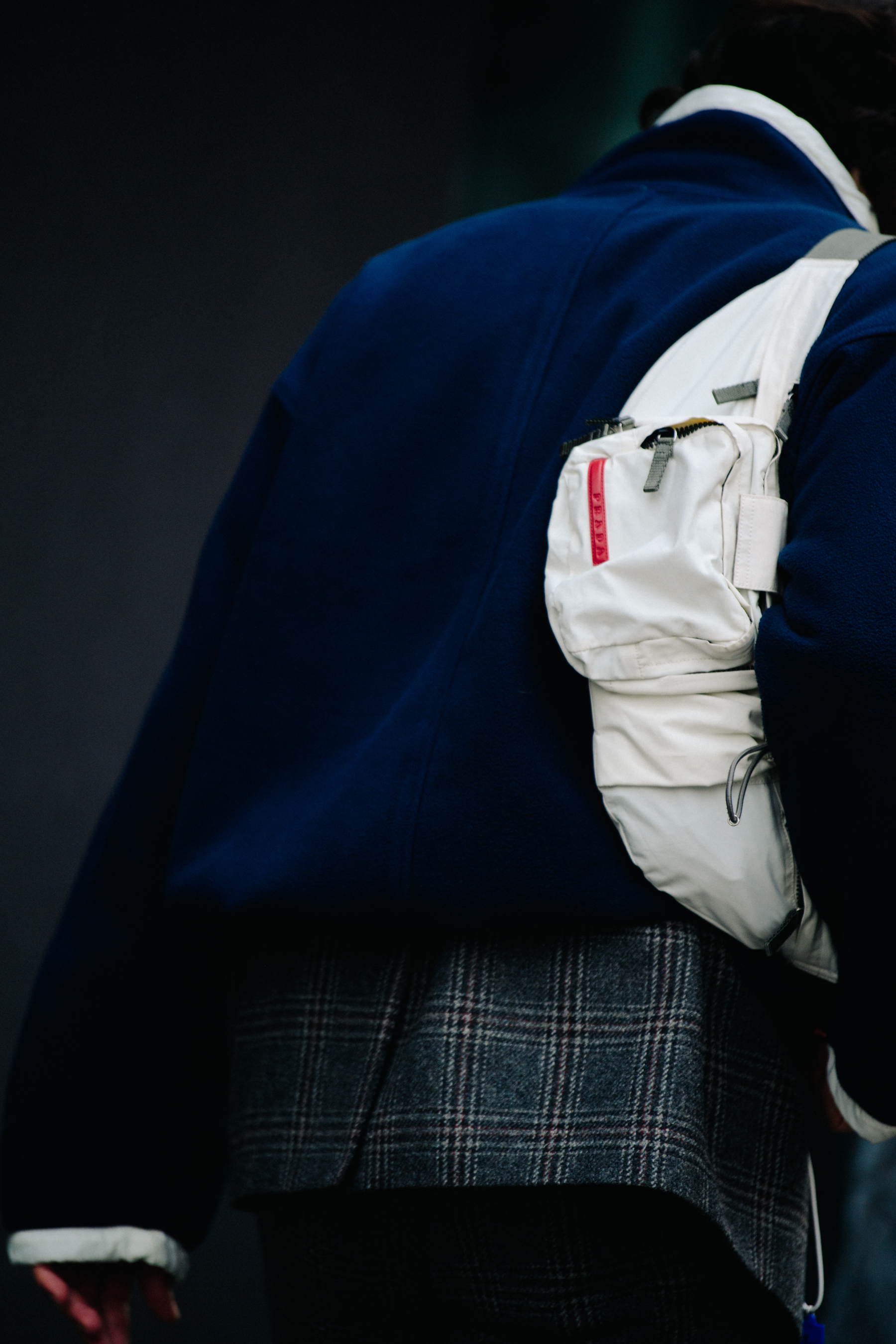 Man carrying Prada bag