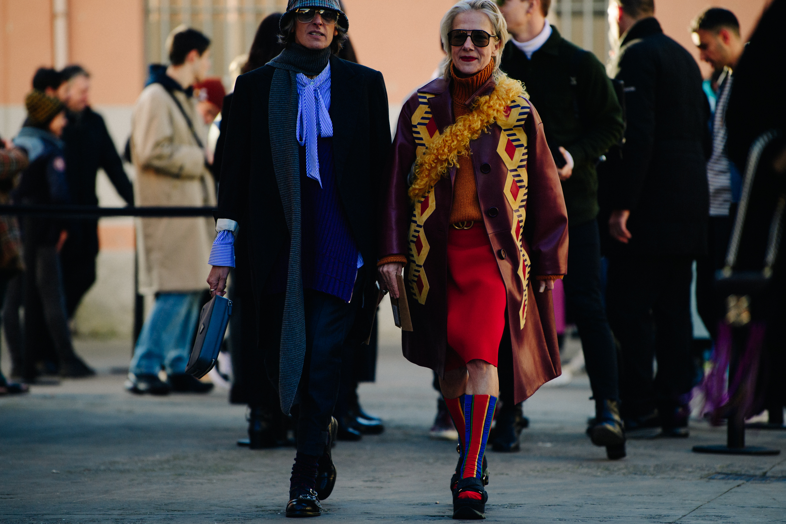 Two women wearing long outfits