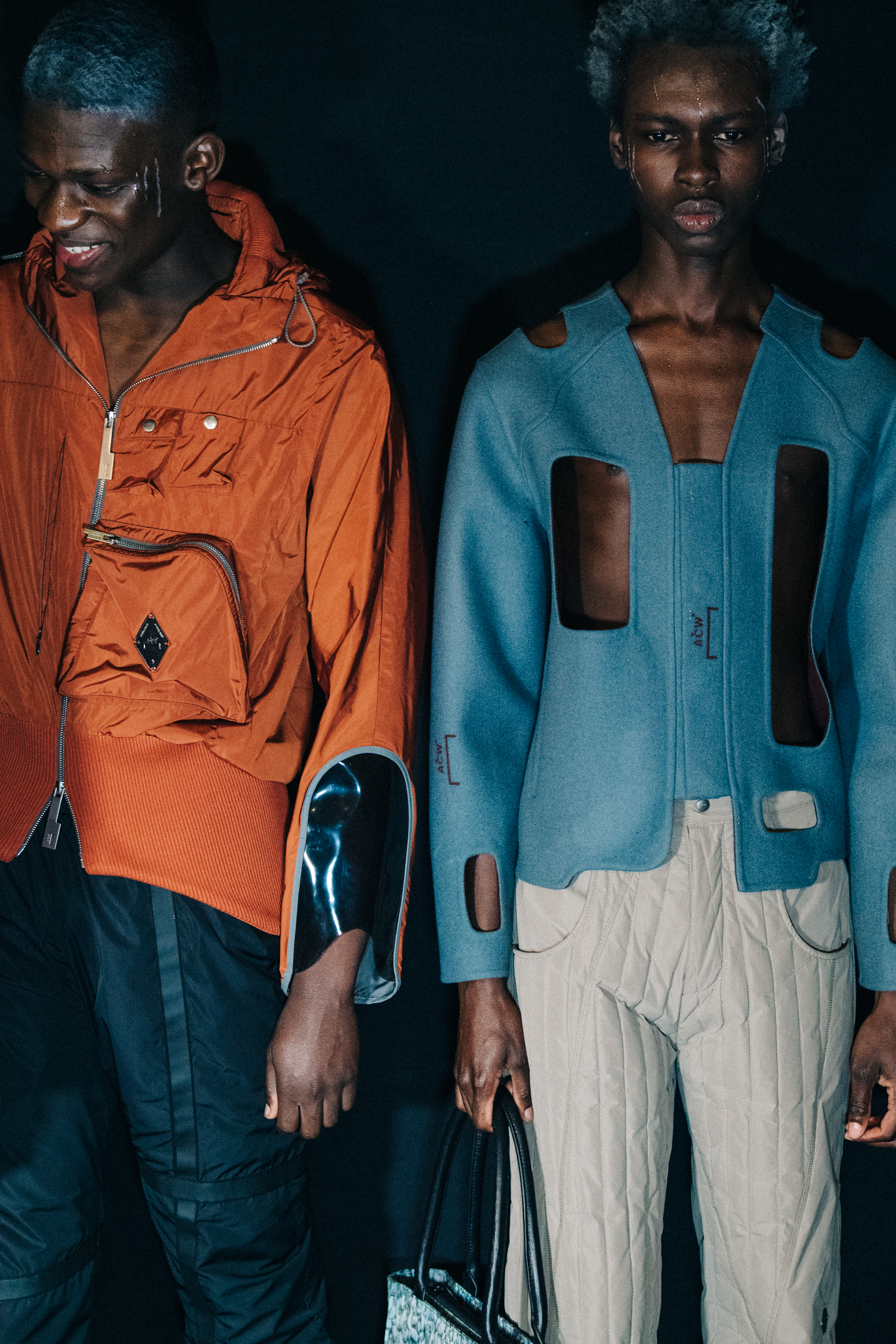 Models wearing orange and blue at A COLD WALL