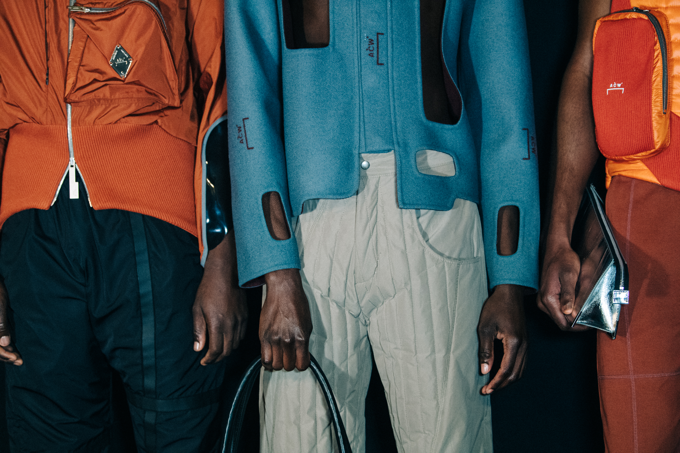 Models wearing orange and blue at A COLD WALL