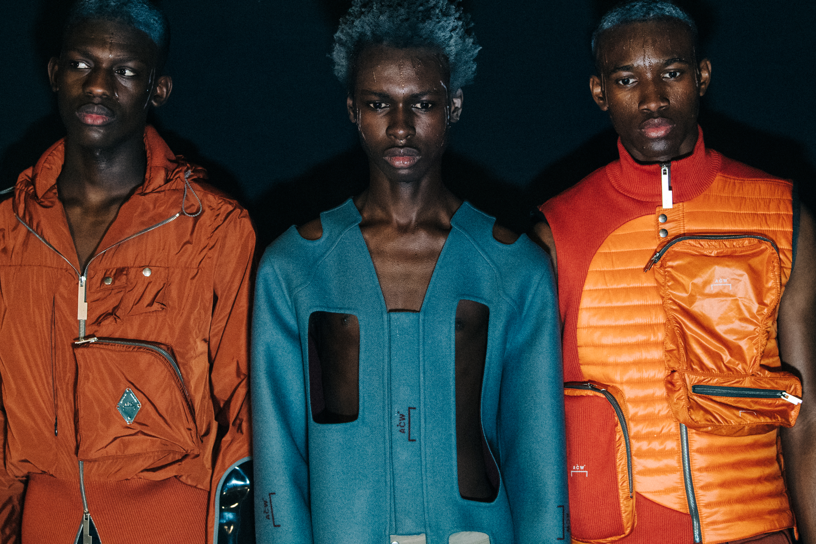 Models wearing orange and blue at A COLD WALL