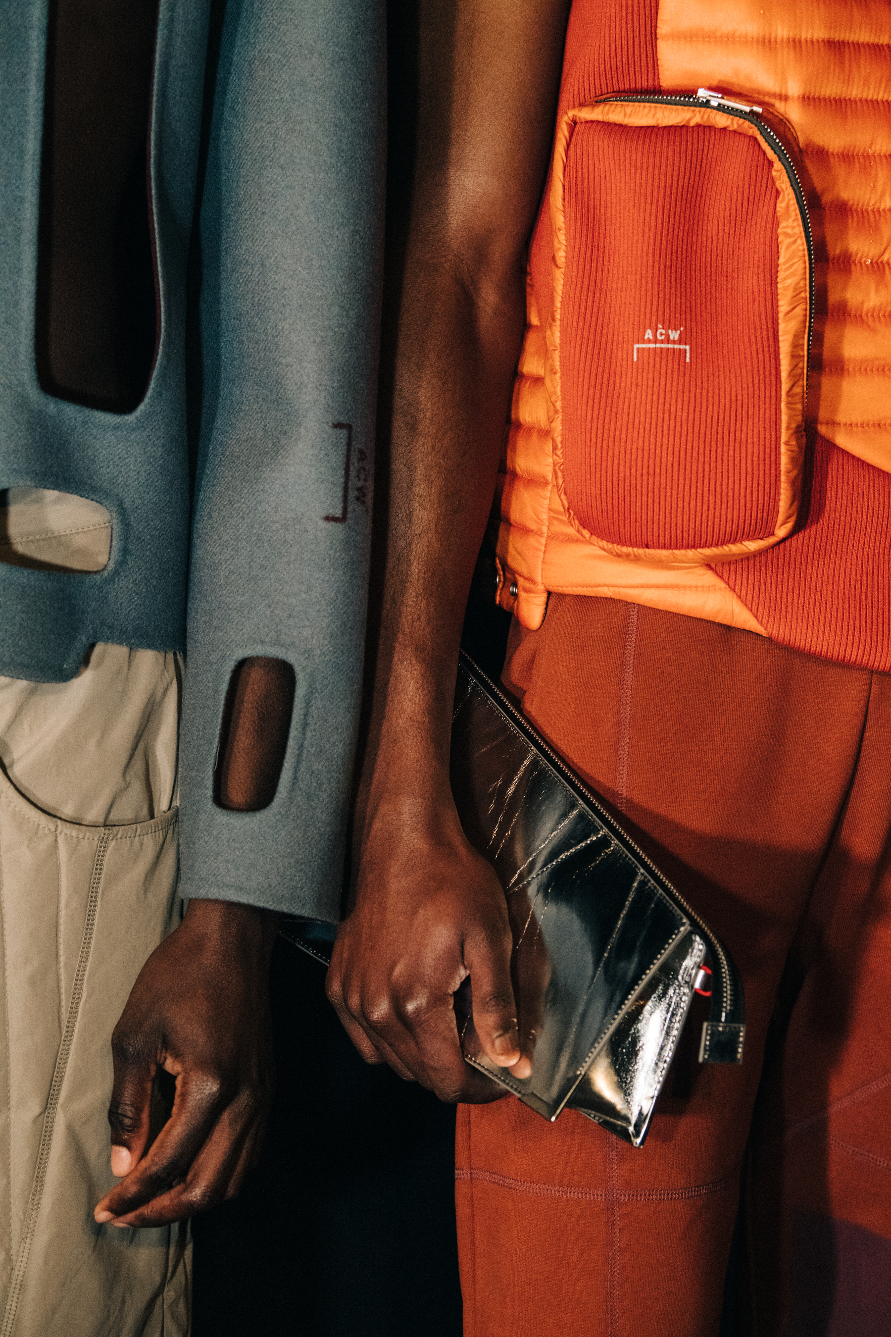 Models wearing orange and blue at A COLD WALL