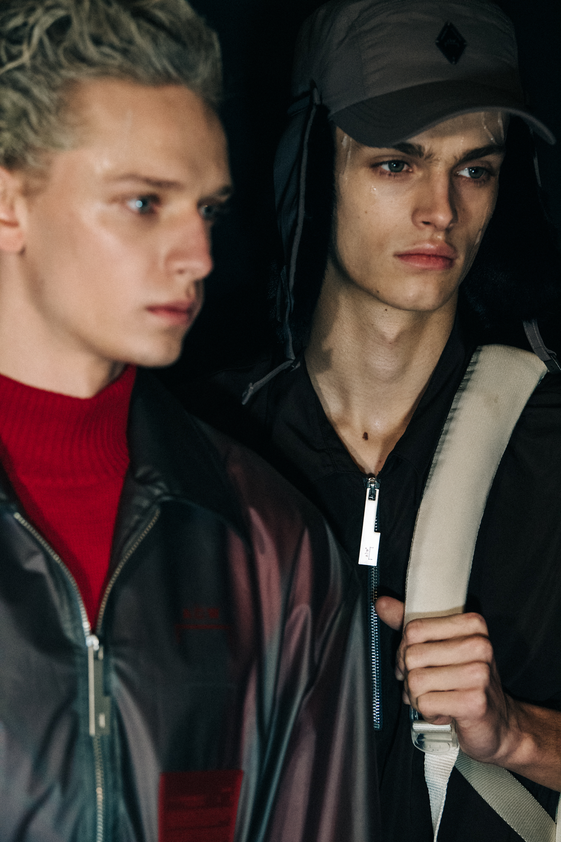 Model wearing hat backstage at A COLD WALL