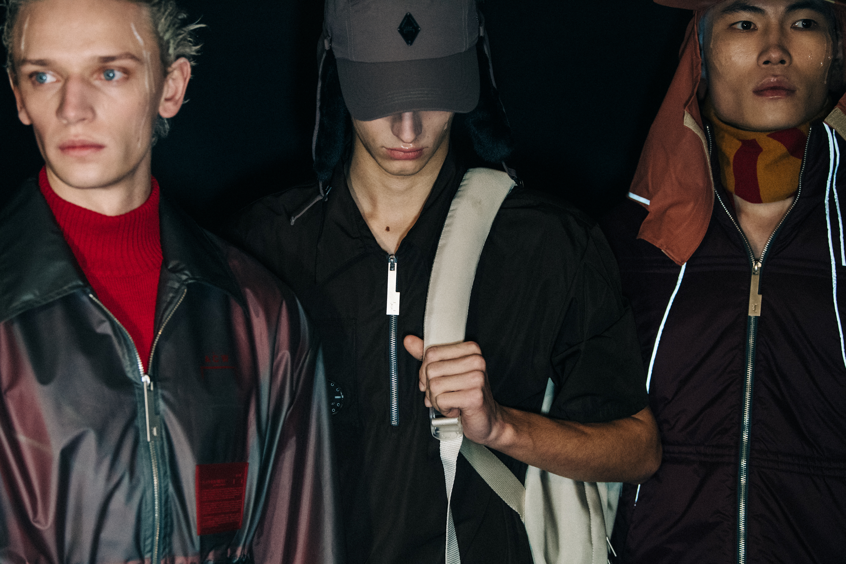 Model wearing hat backstage at A COLD WALL