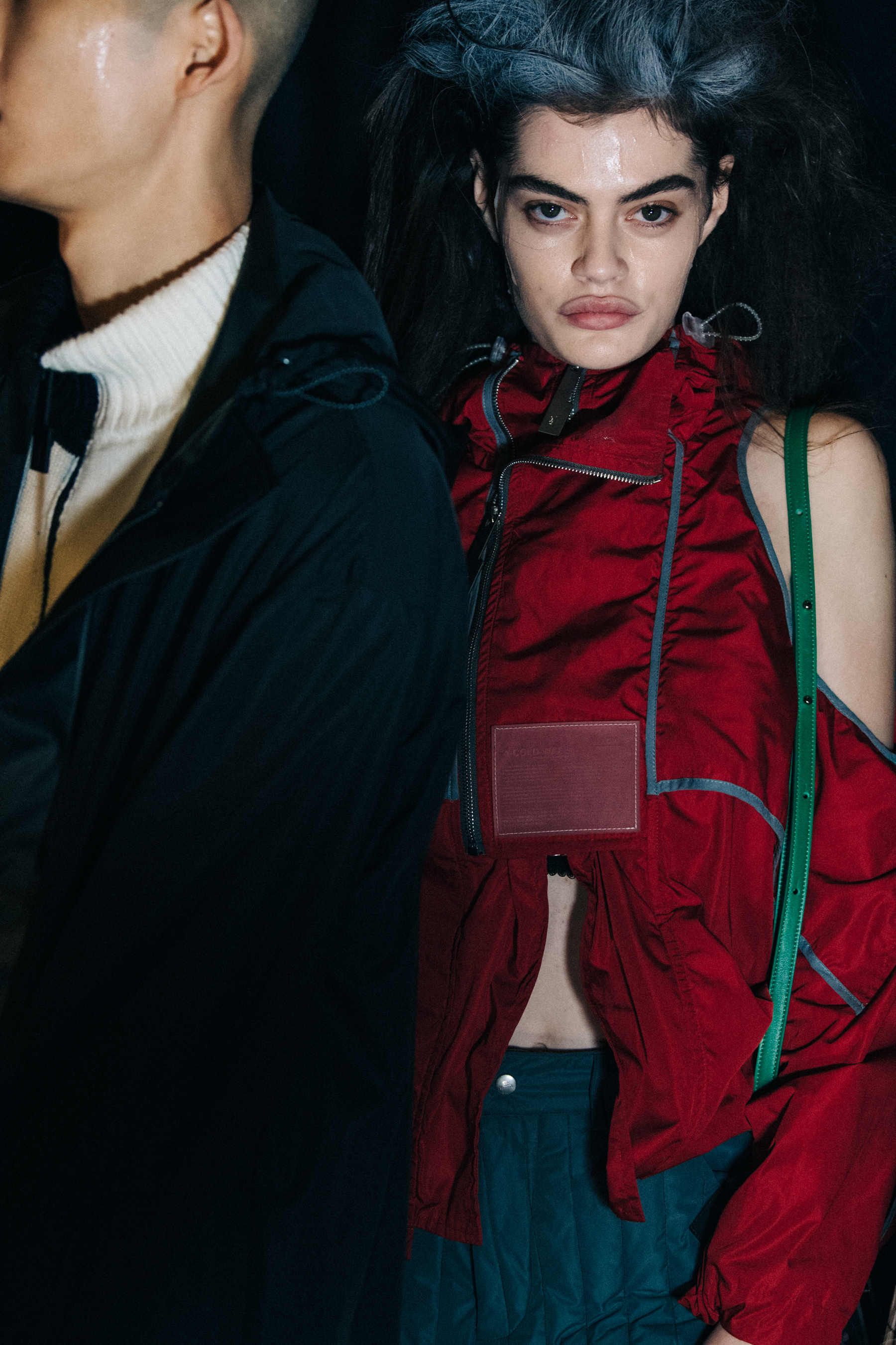 Model wearing red at A COLD WALL
