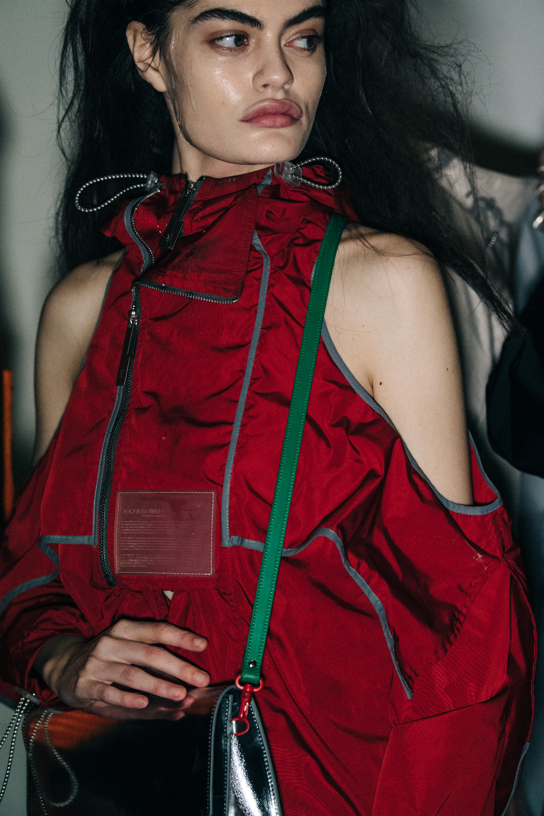 Model wearing red at A COLD WALL