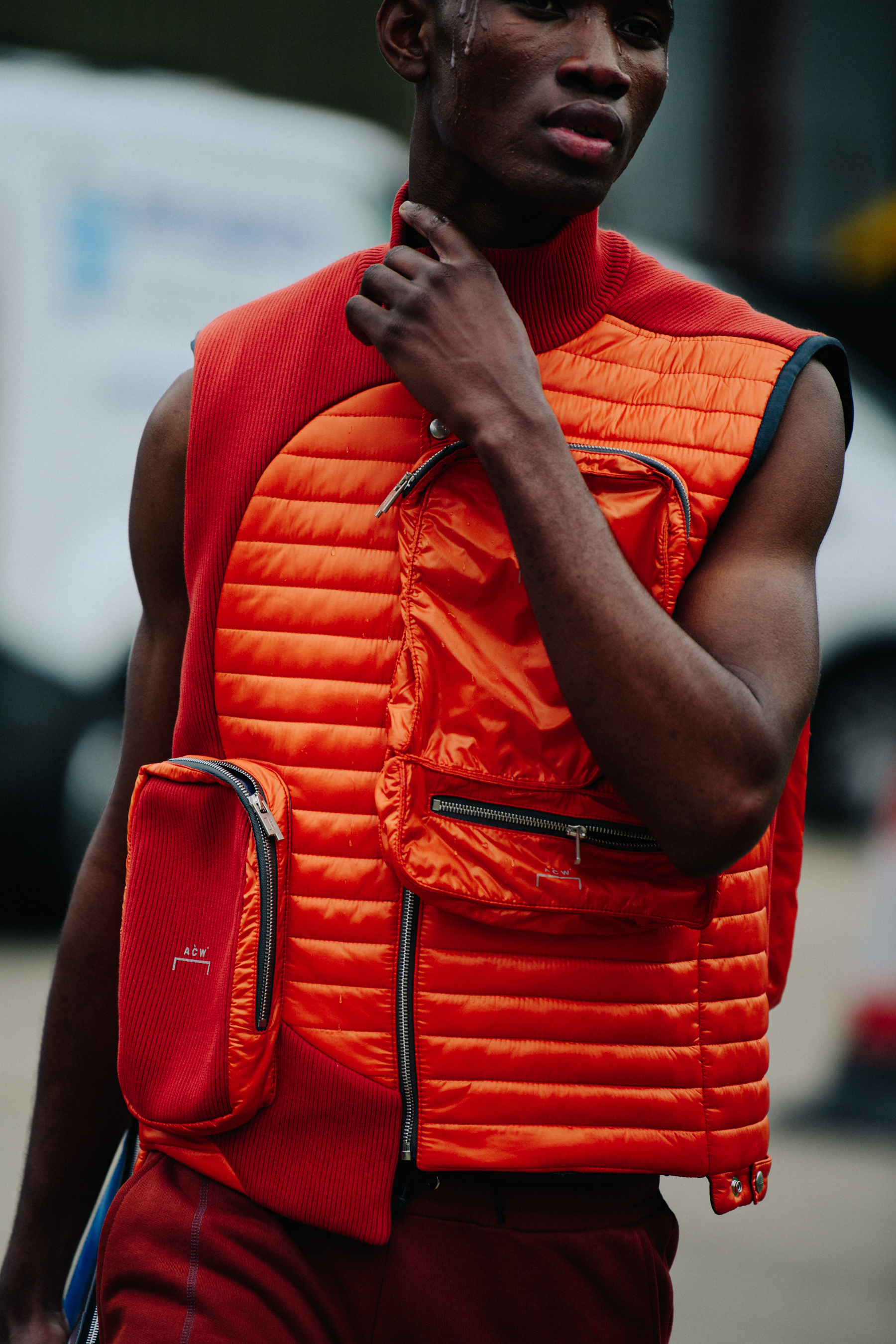 Model wearing orange outfit at A COLD WALL