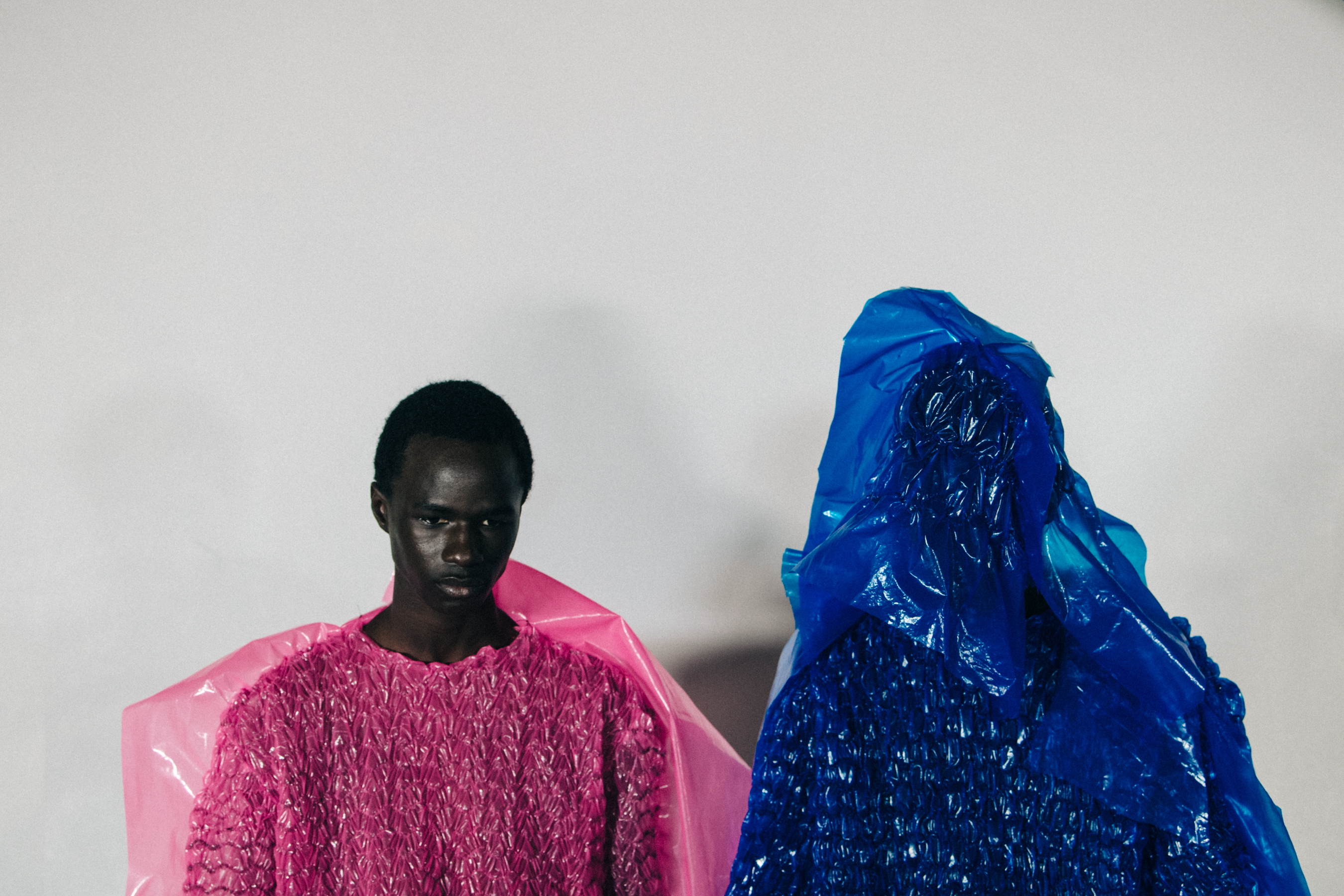 Models wearing colourful outfits at Craig Green
