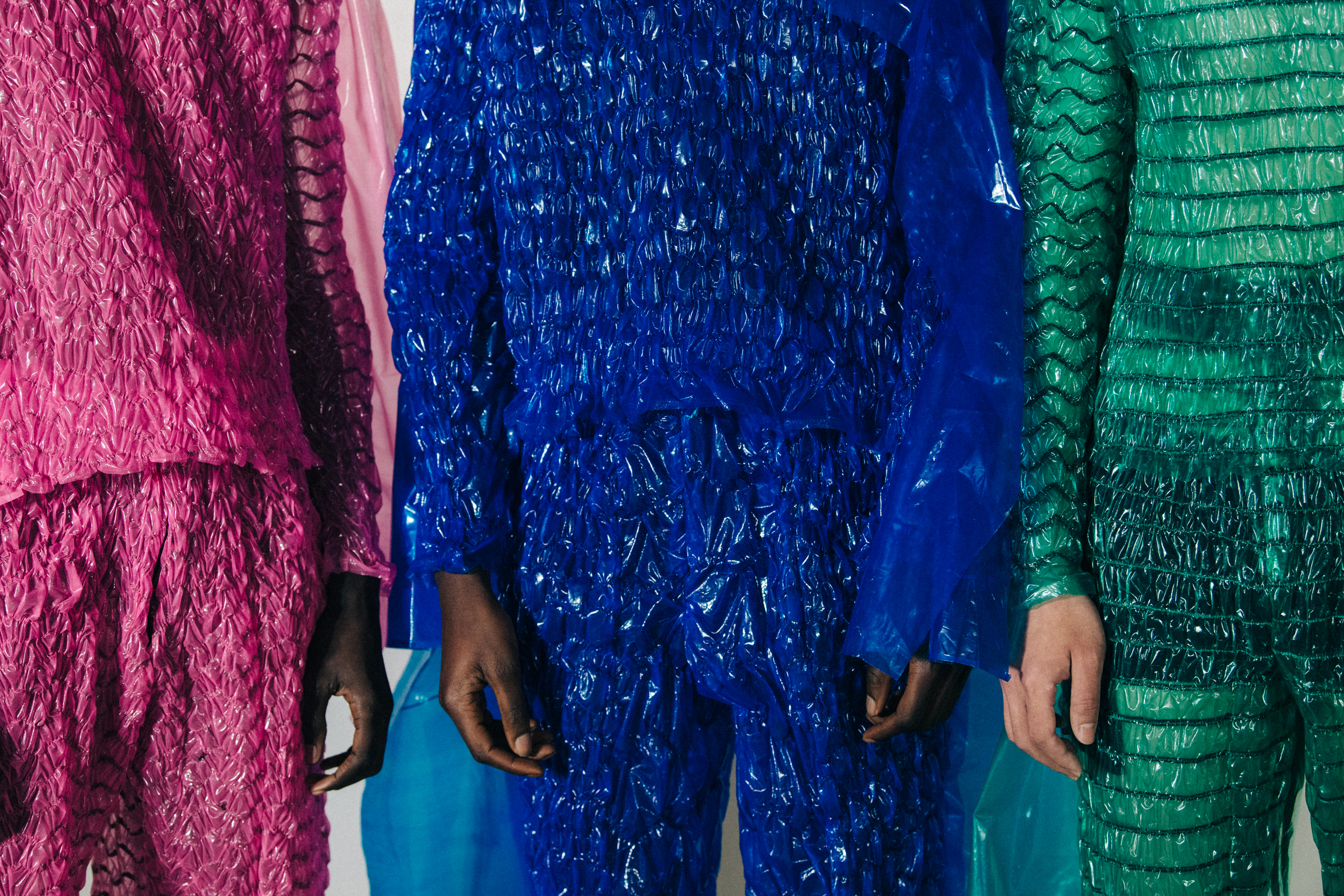 Models wearing colourful outfits at Craig Green