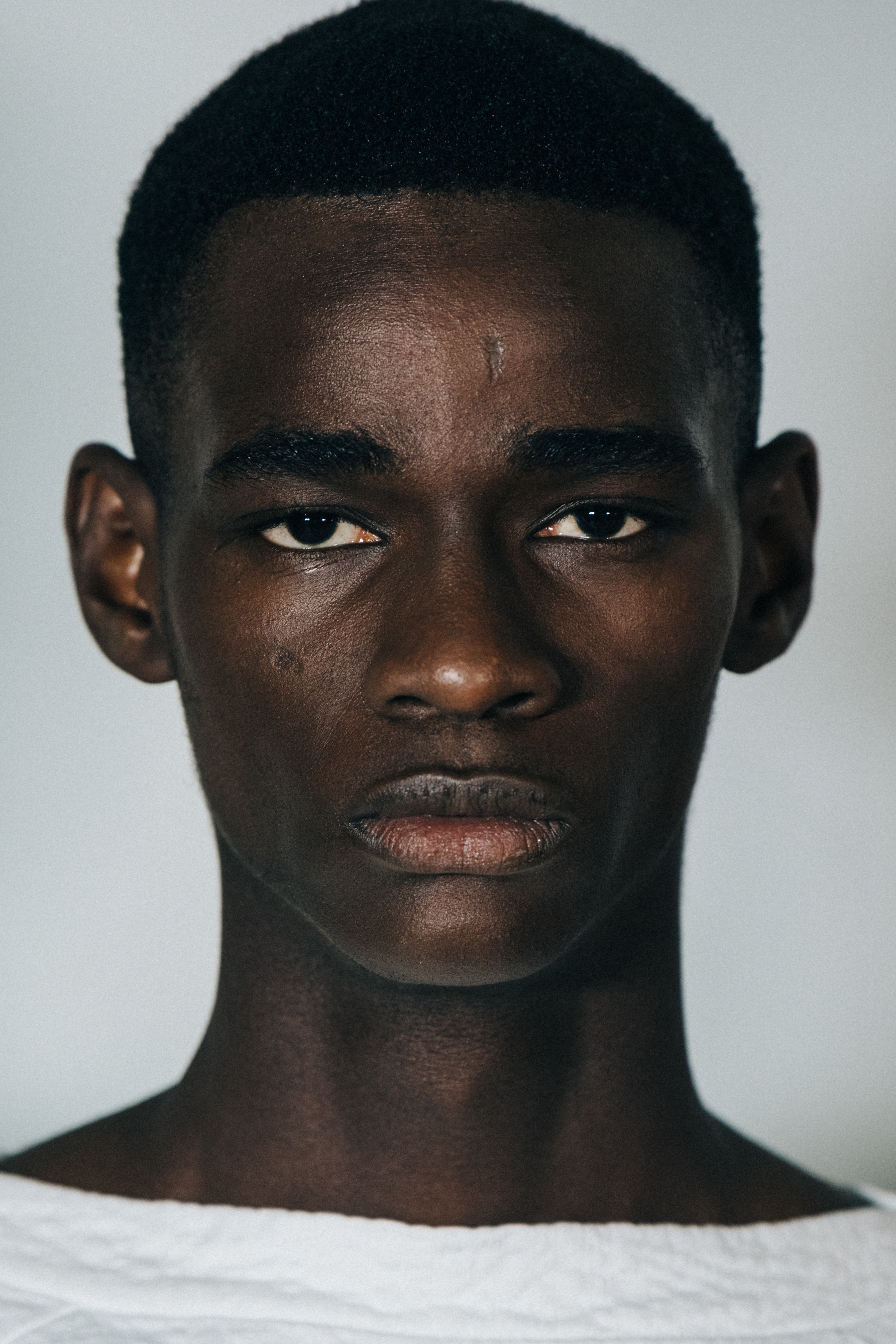 Portrait of model with short black hair