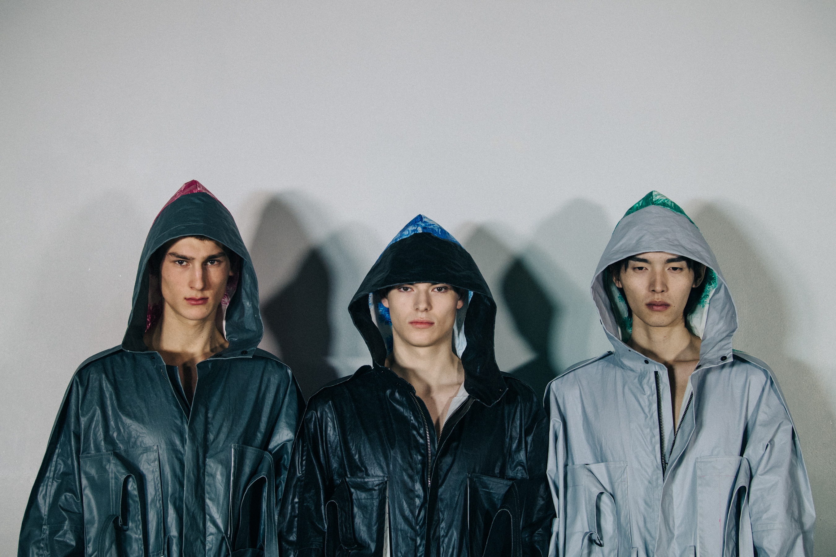 Models wearing hooded coats
