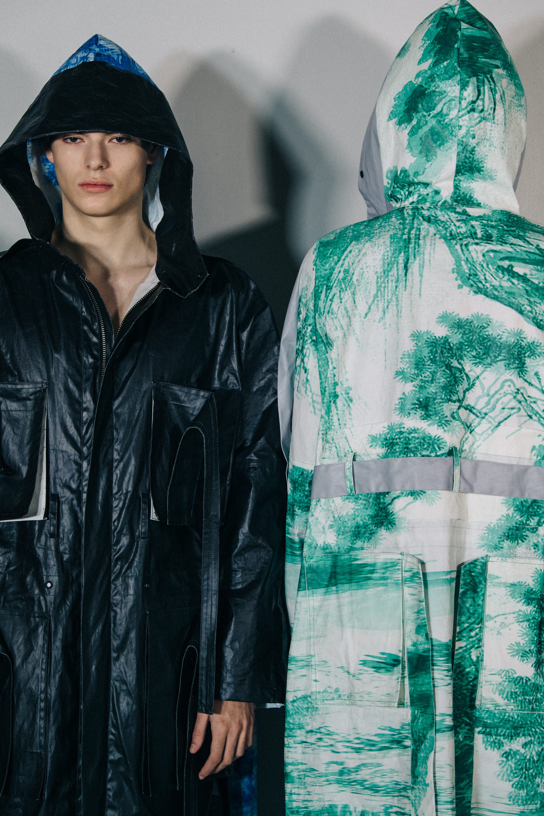 Models wearing hooded coats