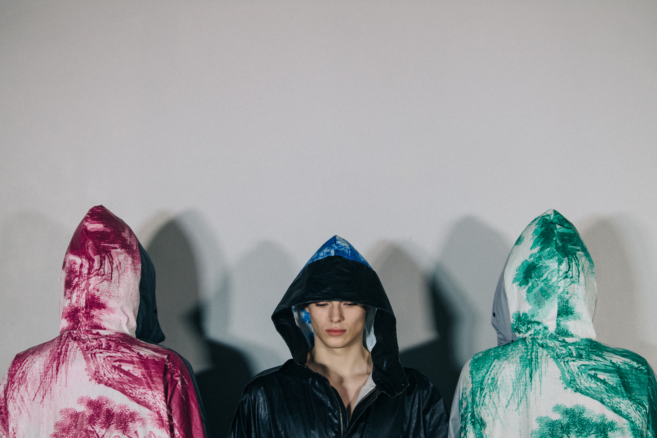 Models wearing hooded coats