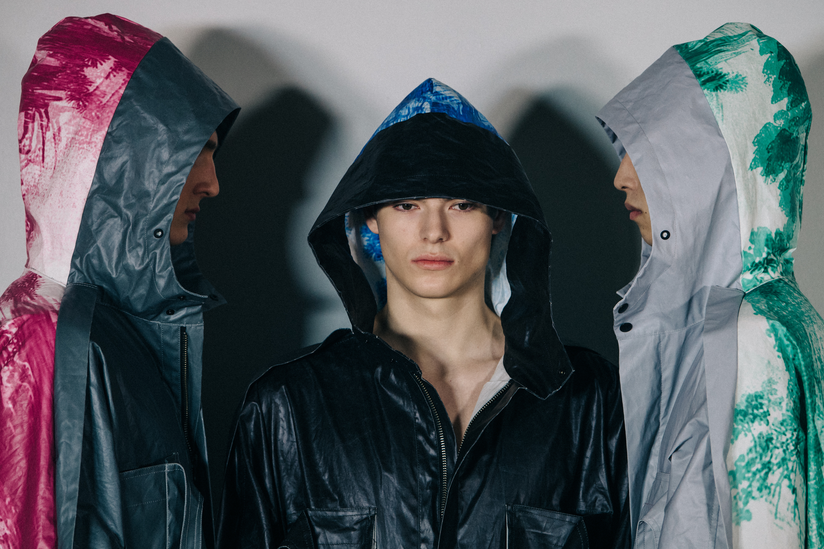 Models wearing hooded coats