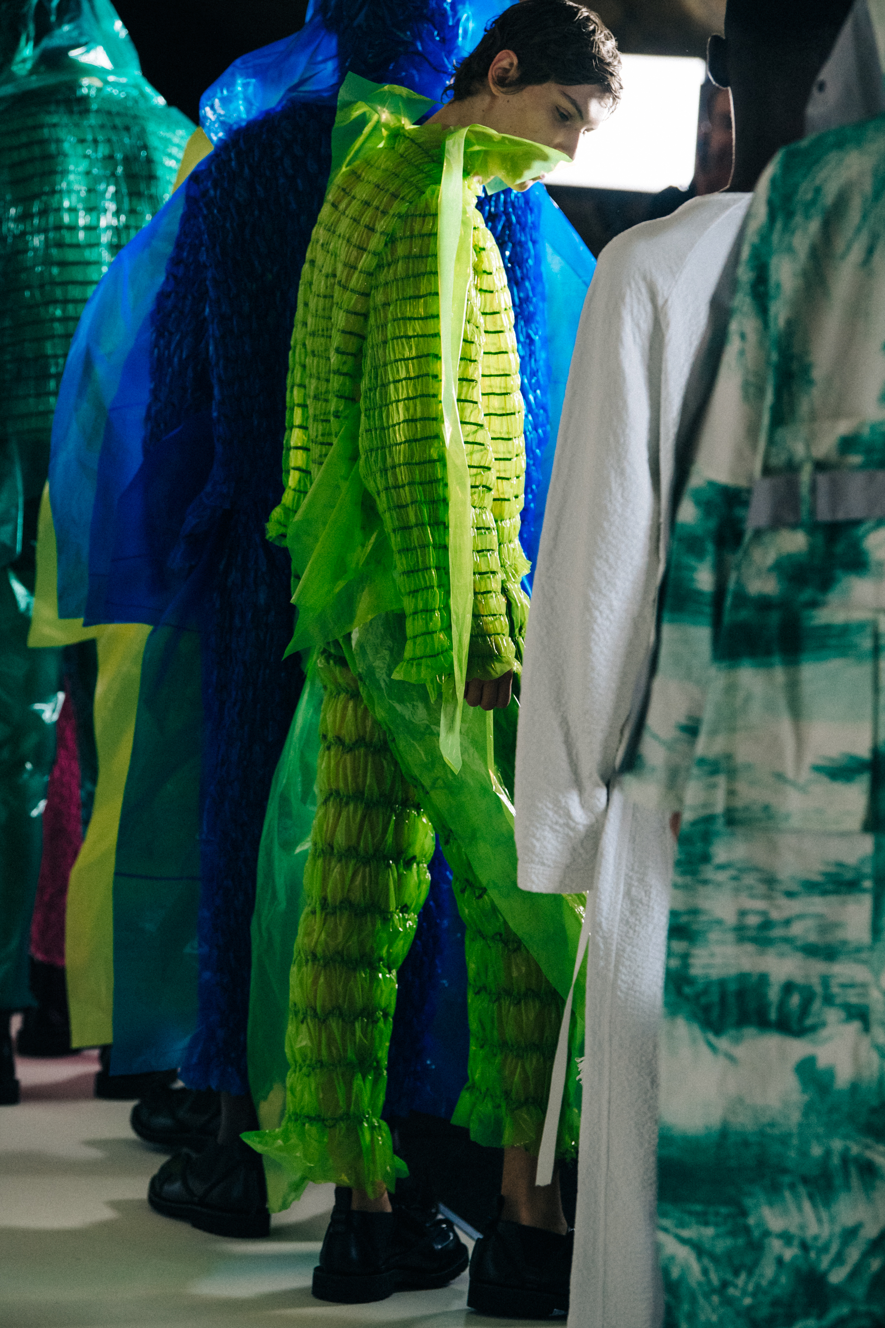 Models wearing colourful outfits at Craig Green