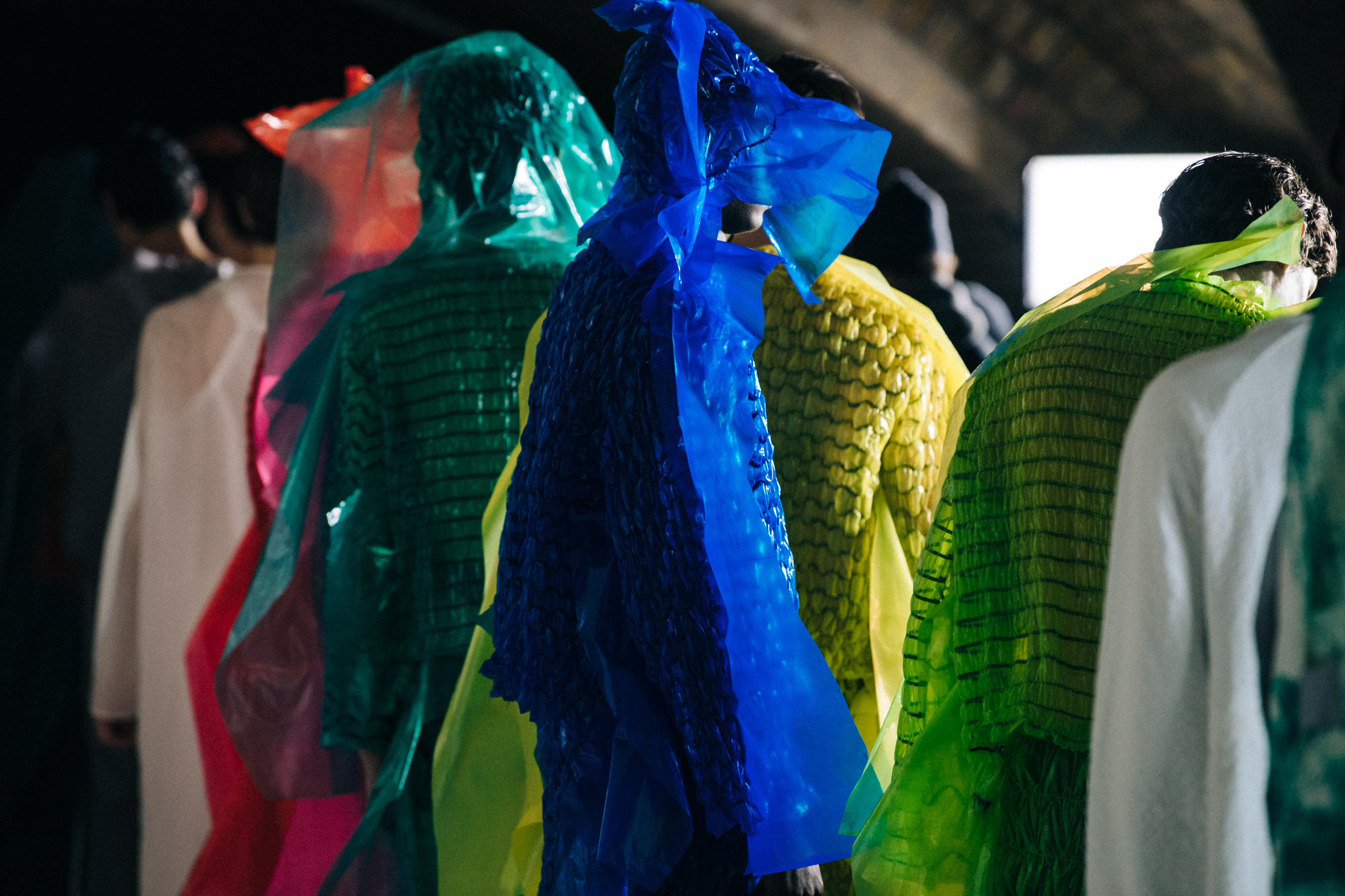 Models wearing colourful outfits at Craig Green