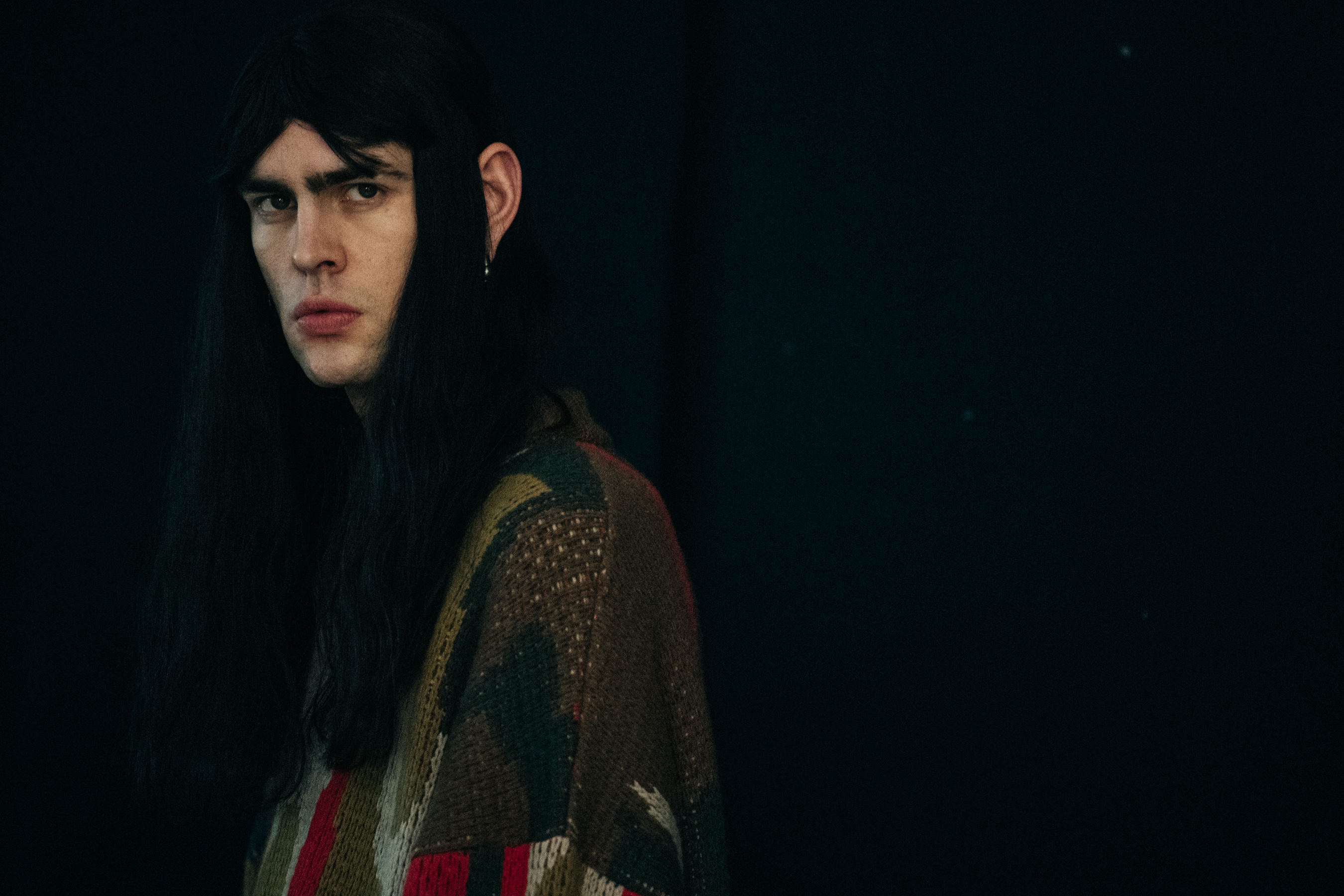 Model wearing wool jumper backstage