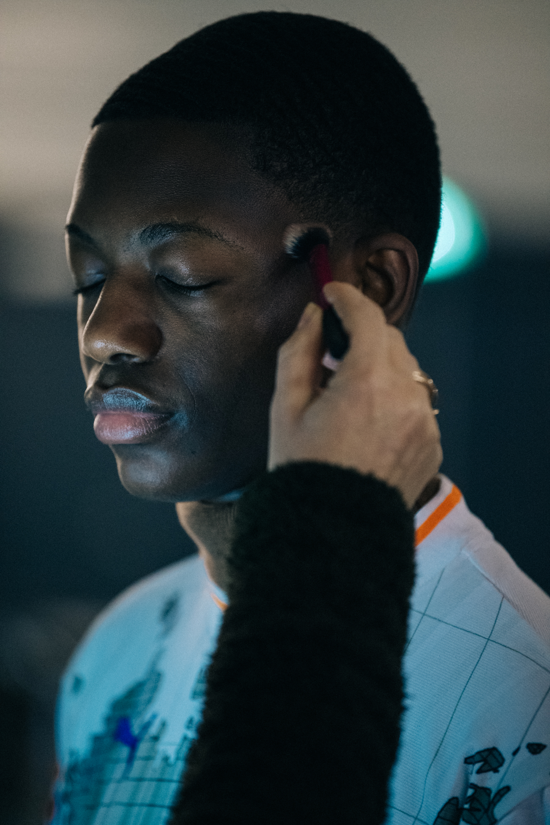 Model in hair and makeup backstage