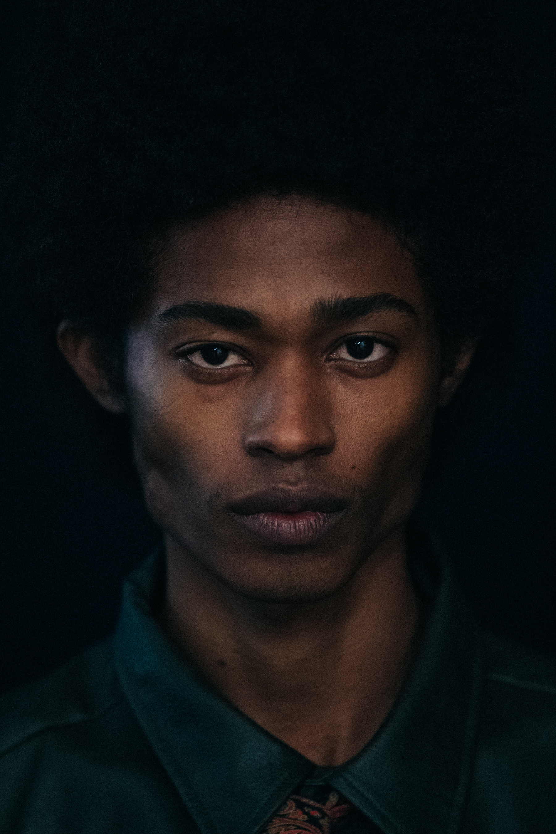 Portrait of model with thick black hair