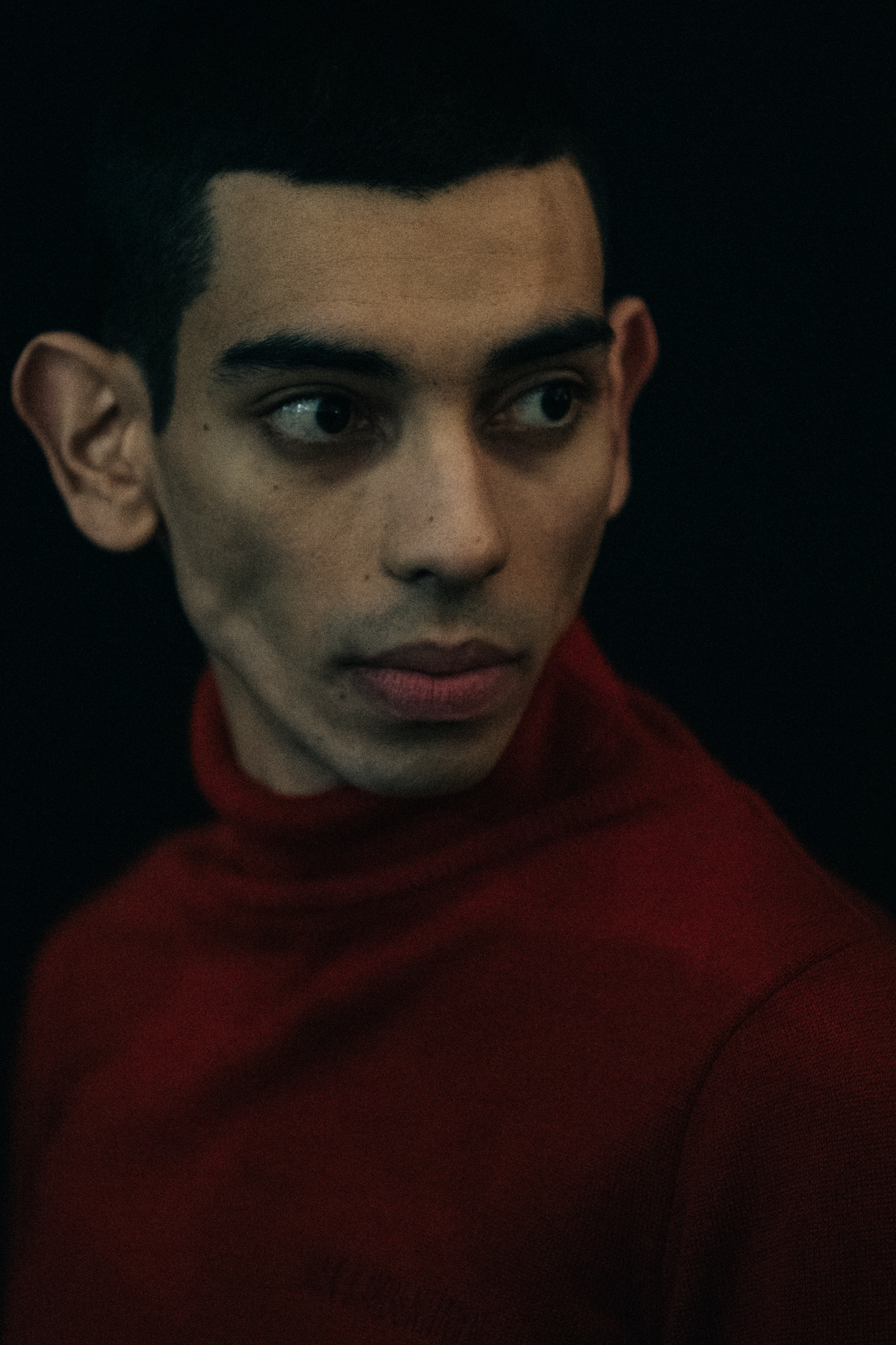 Model wearing red jumper