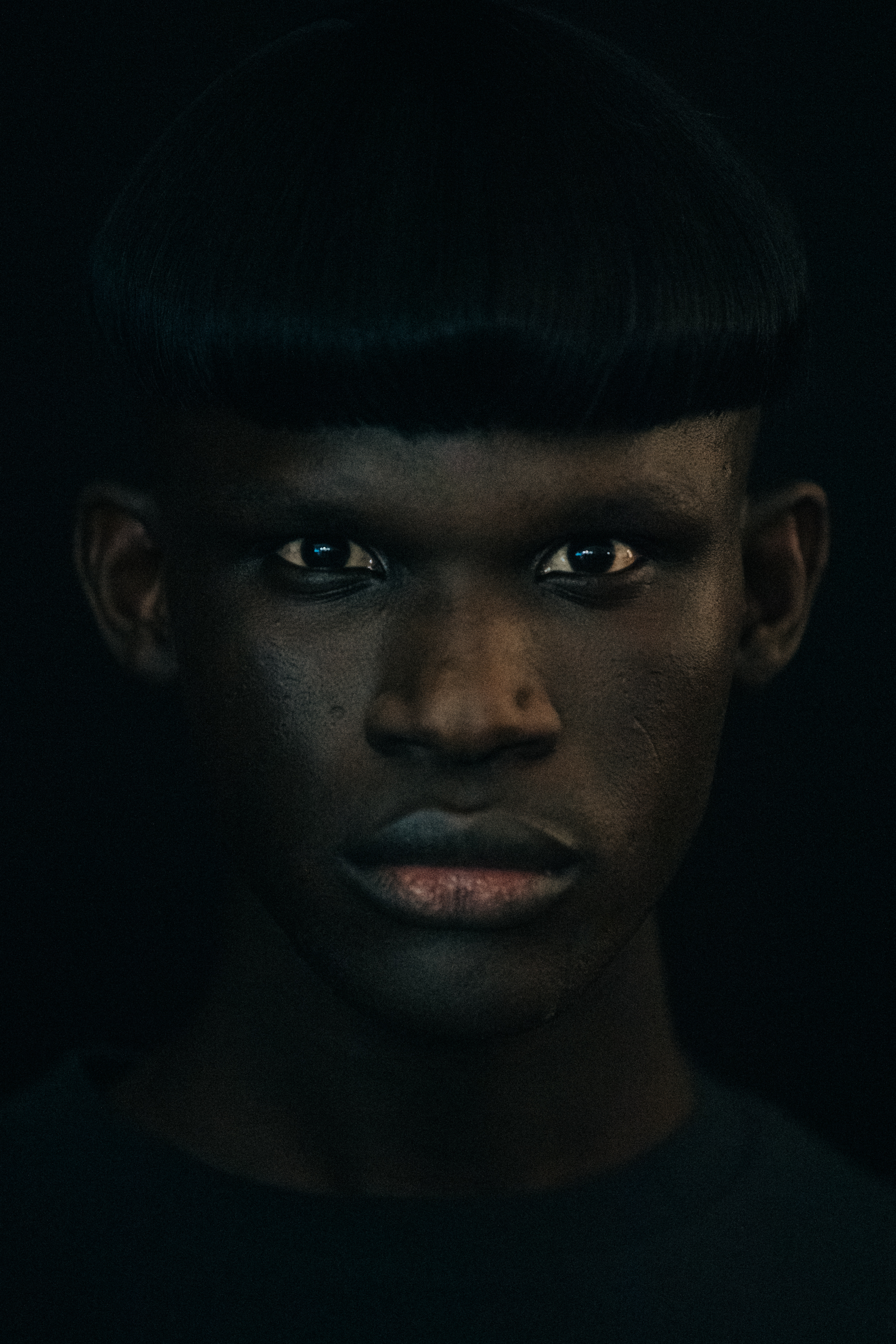 Portrait of model with thick black hair