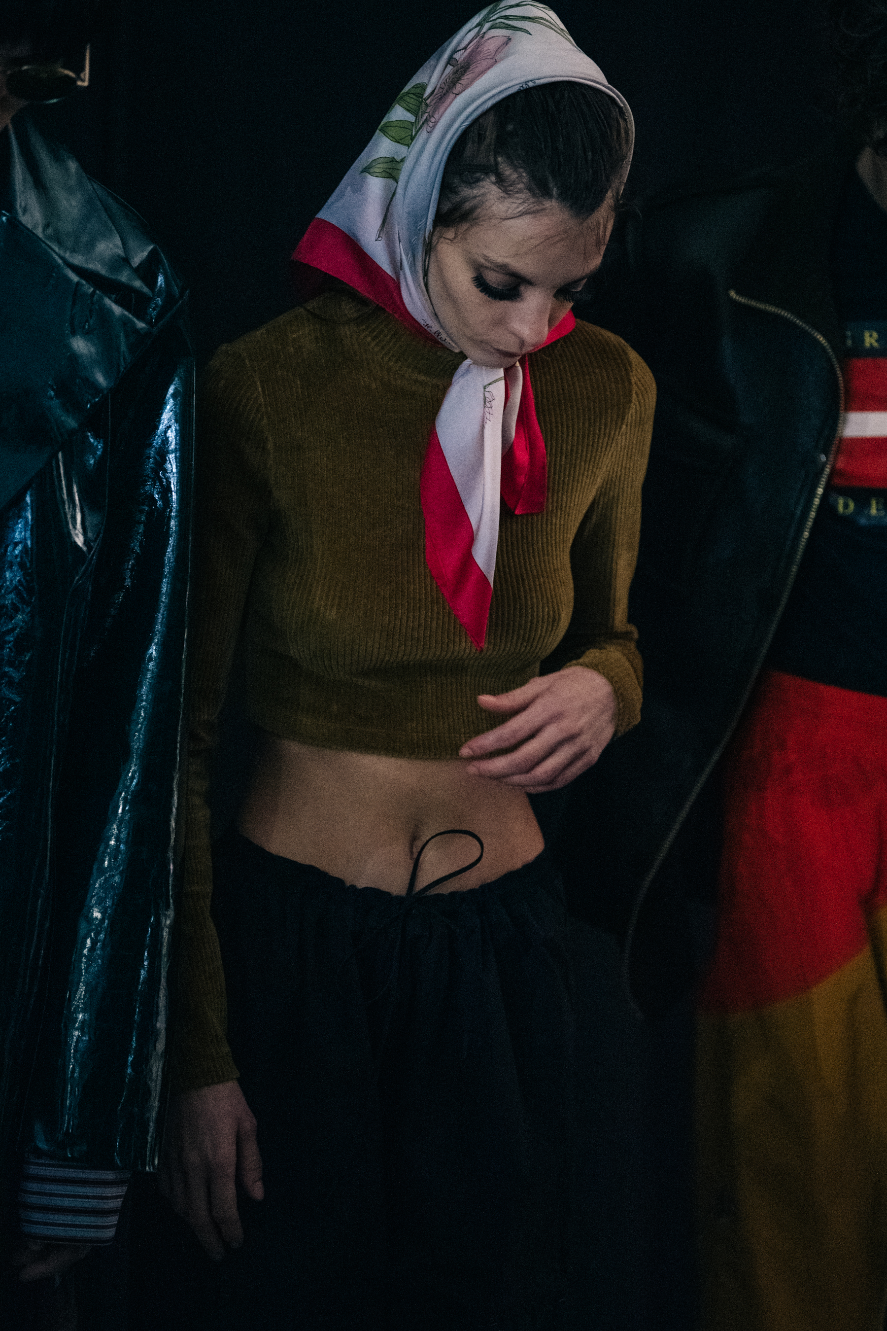 Model wearing red and blue backstage