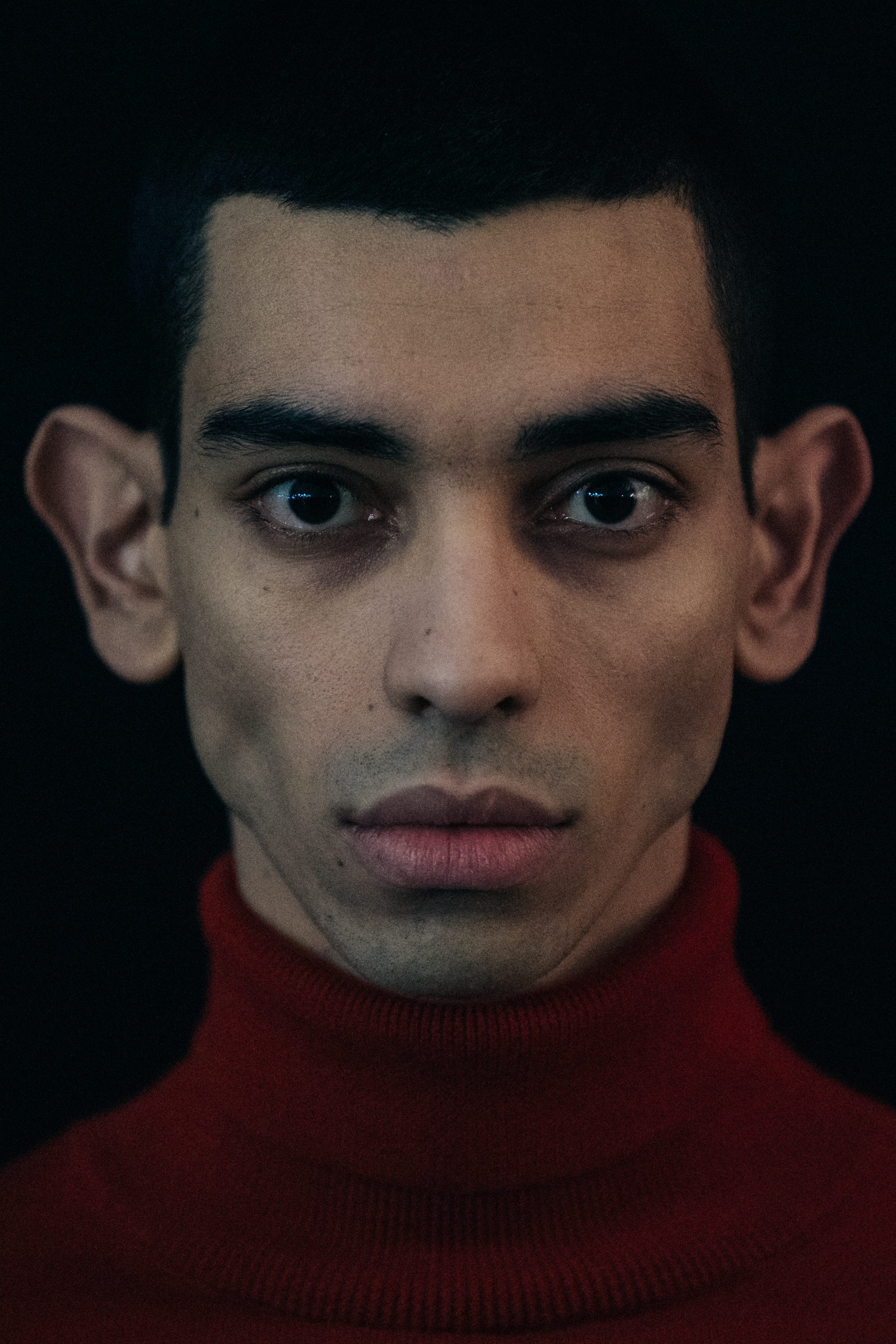 Portrait of model with thick black hair