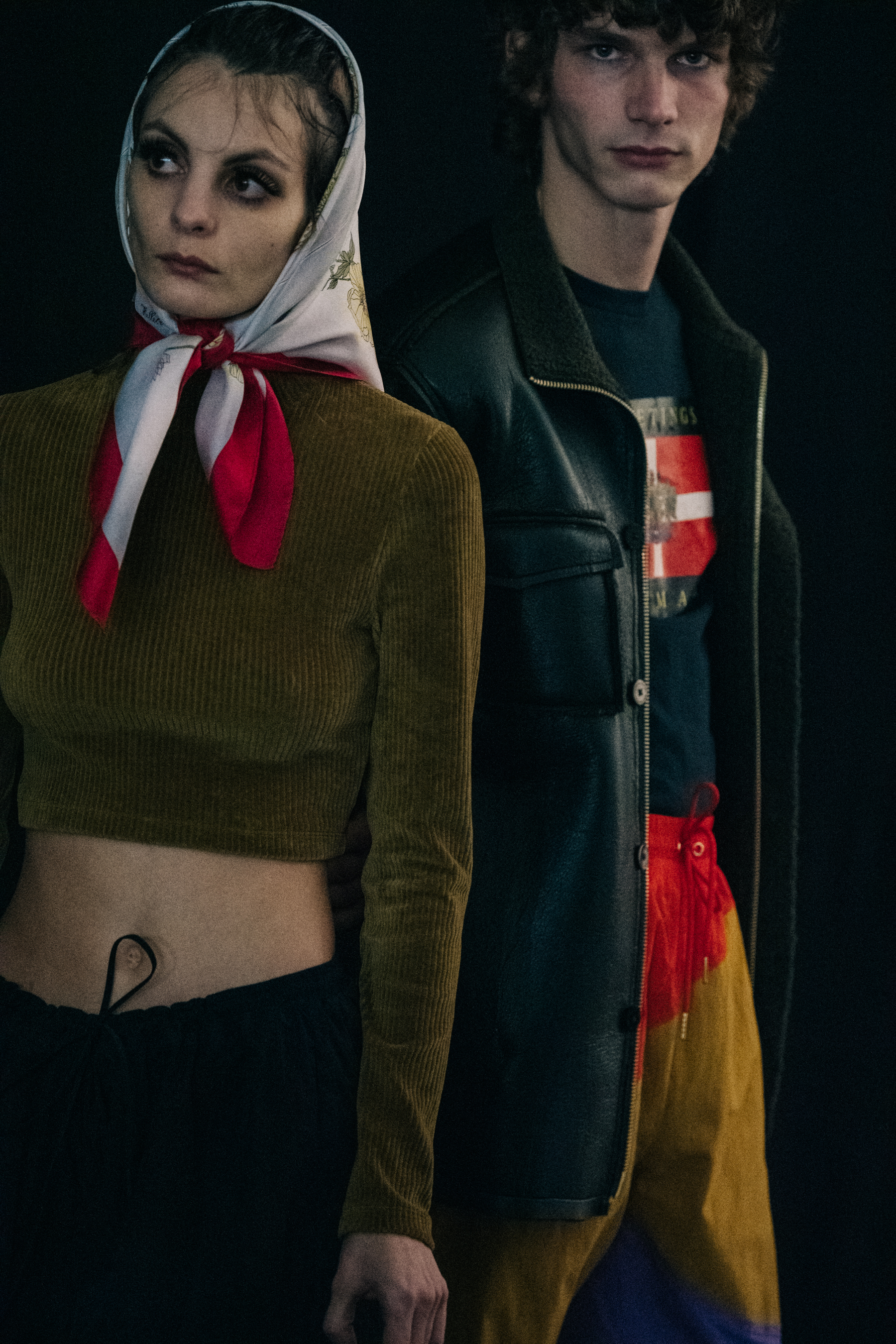Model wearing red and blue backstage