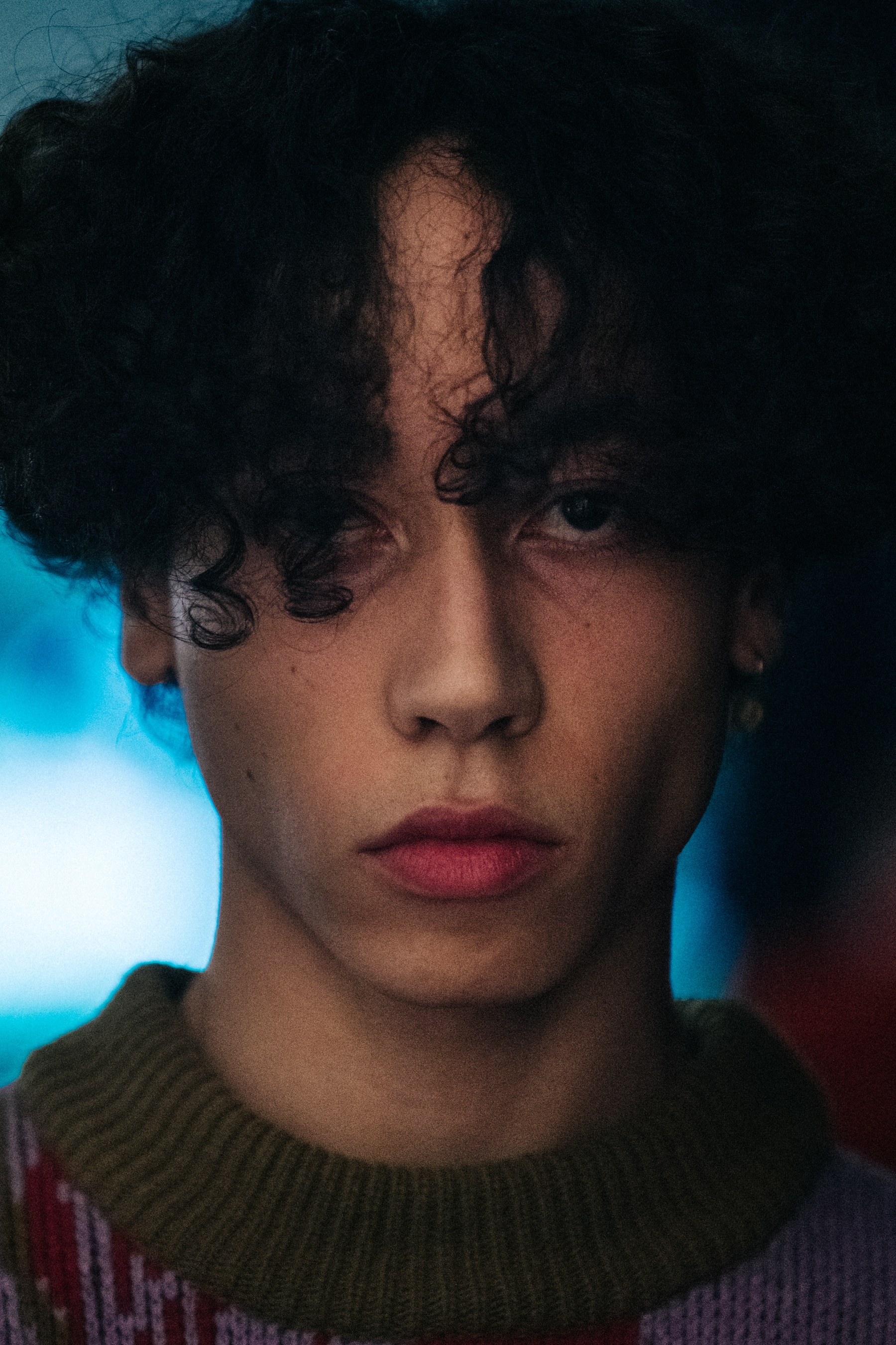 Portrait of model with thick black hair