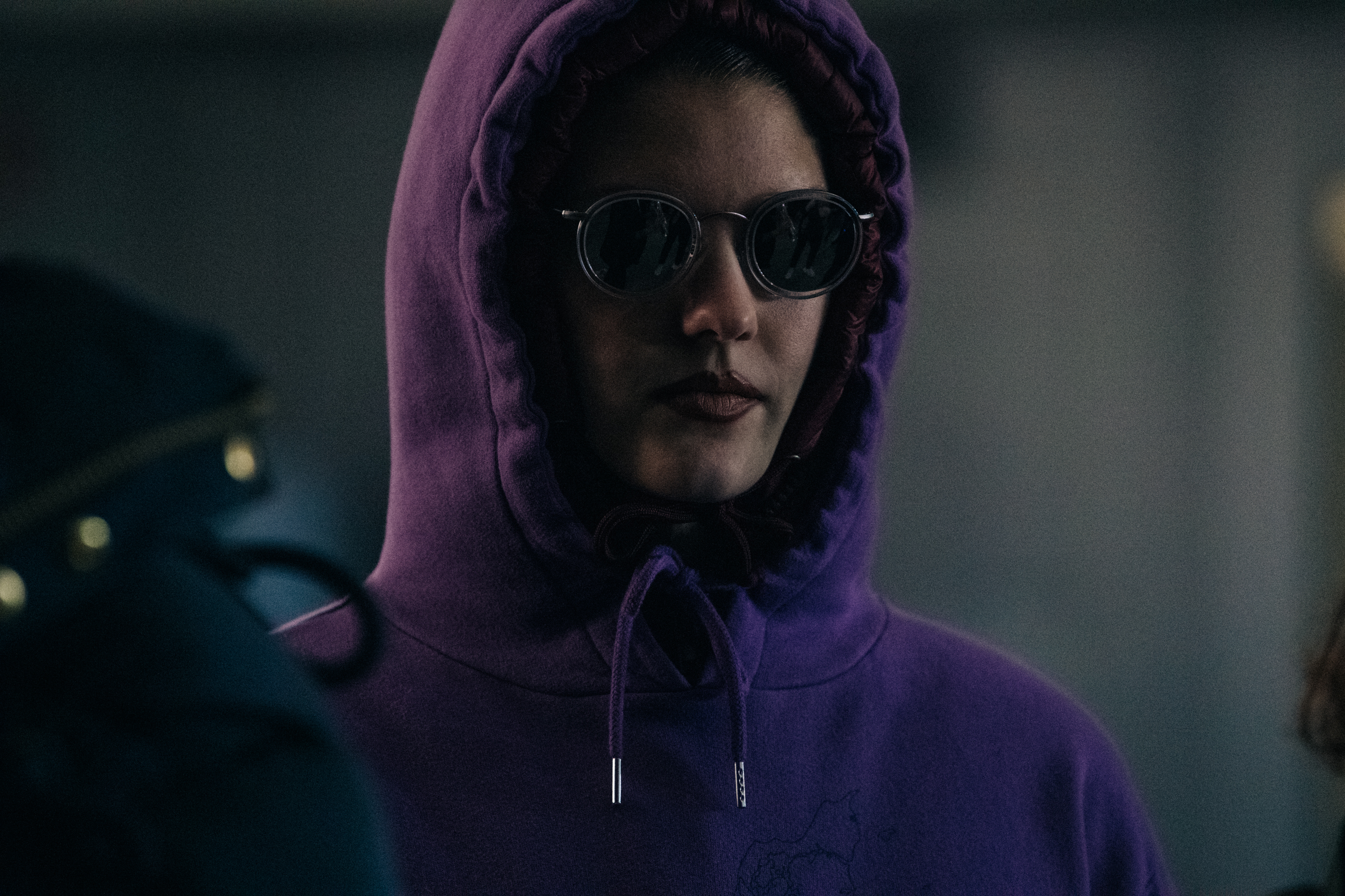 Model wearing sweater backstage