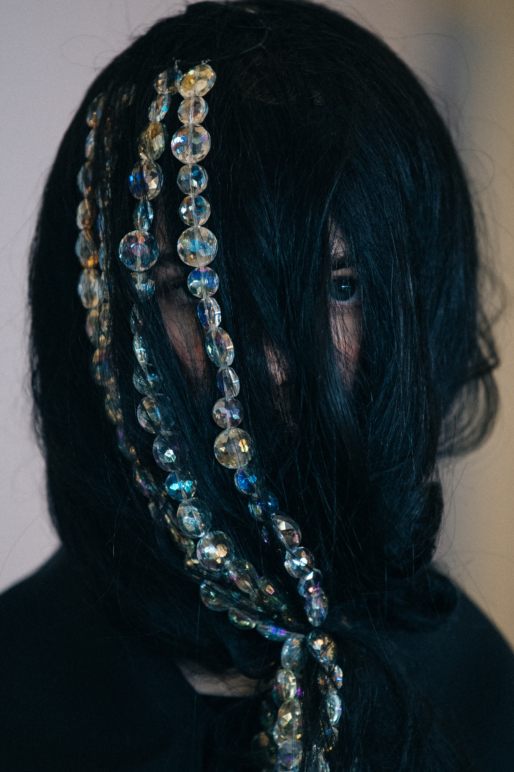 Portrait of model with hair covering face