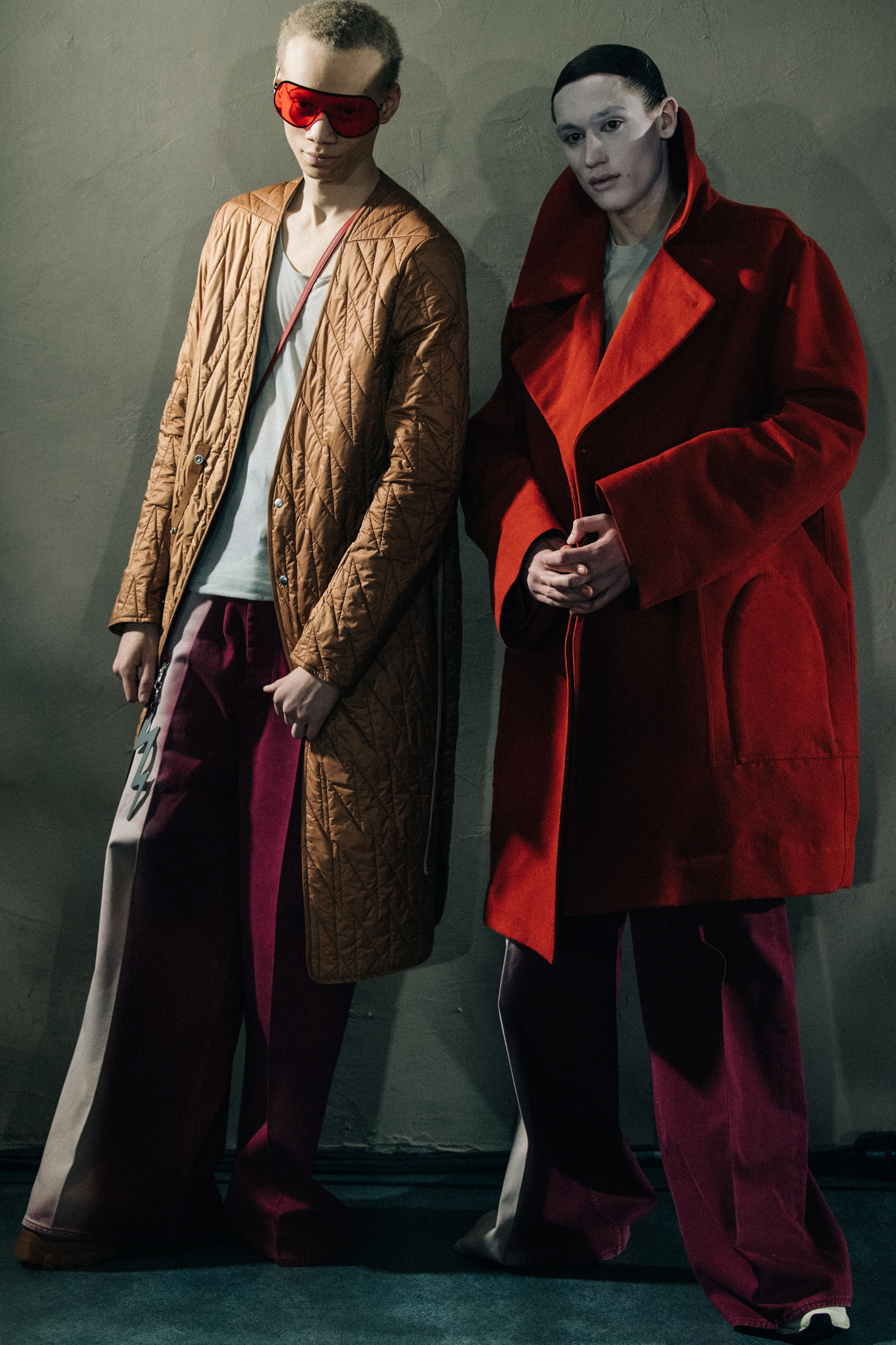 Models wearing long coats at Rick Owens