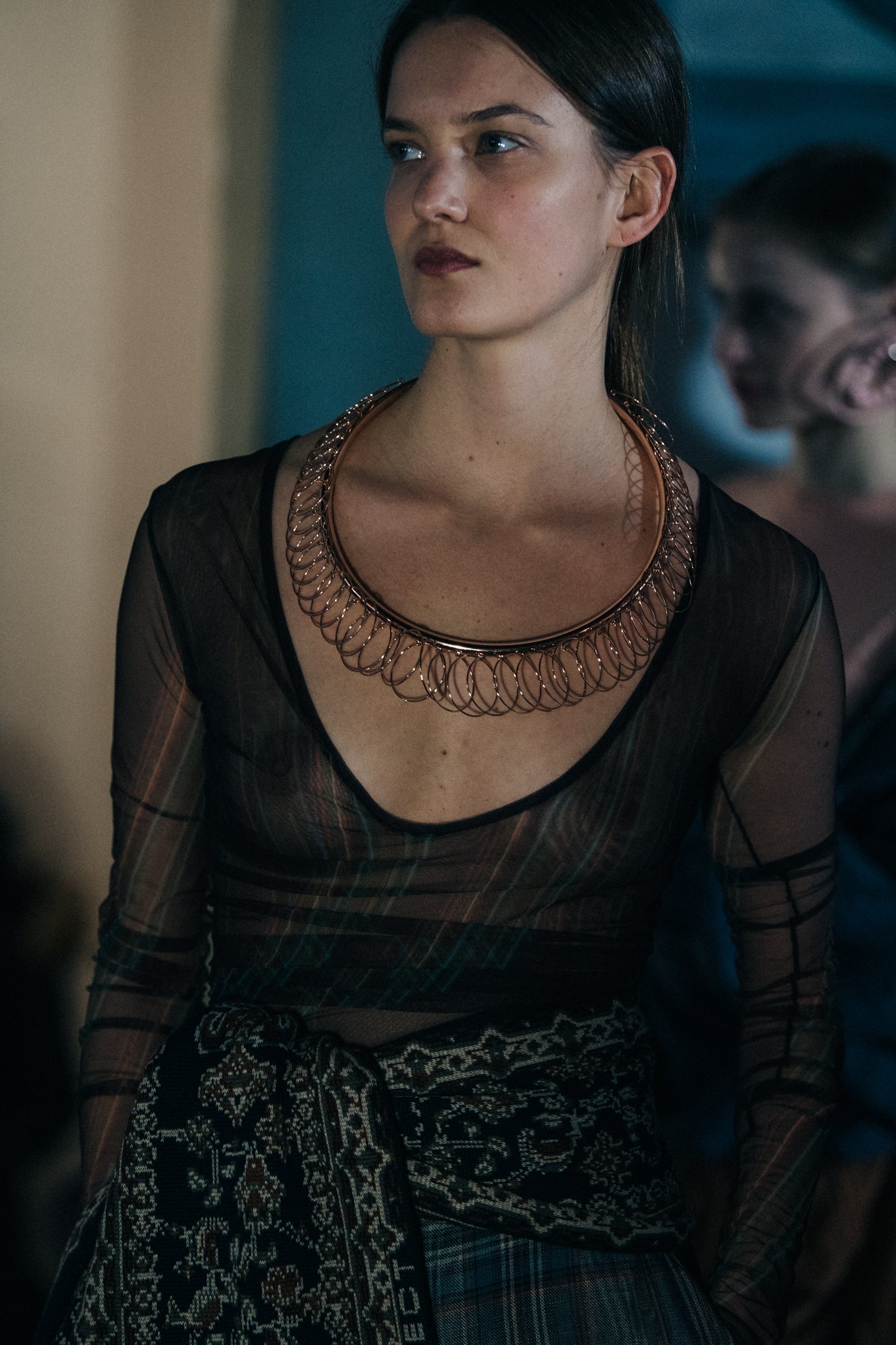 Model wearing gold necklace at Y/Project