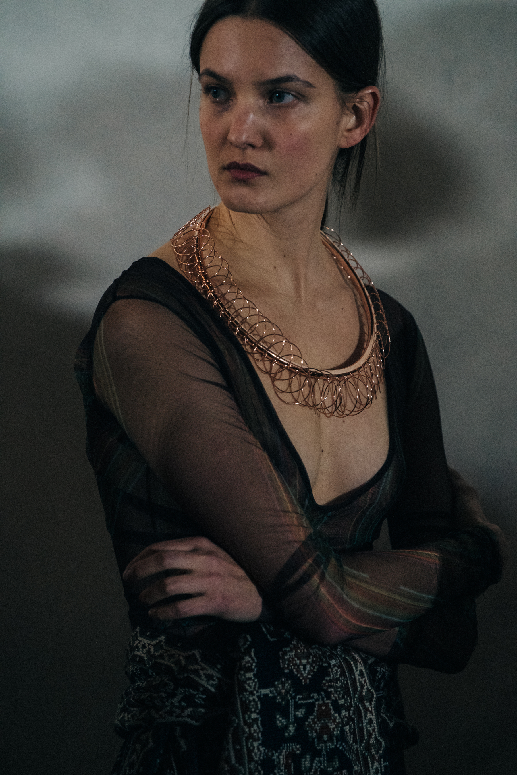 Model wearing gold necklace at Y/Project
