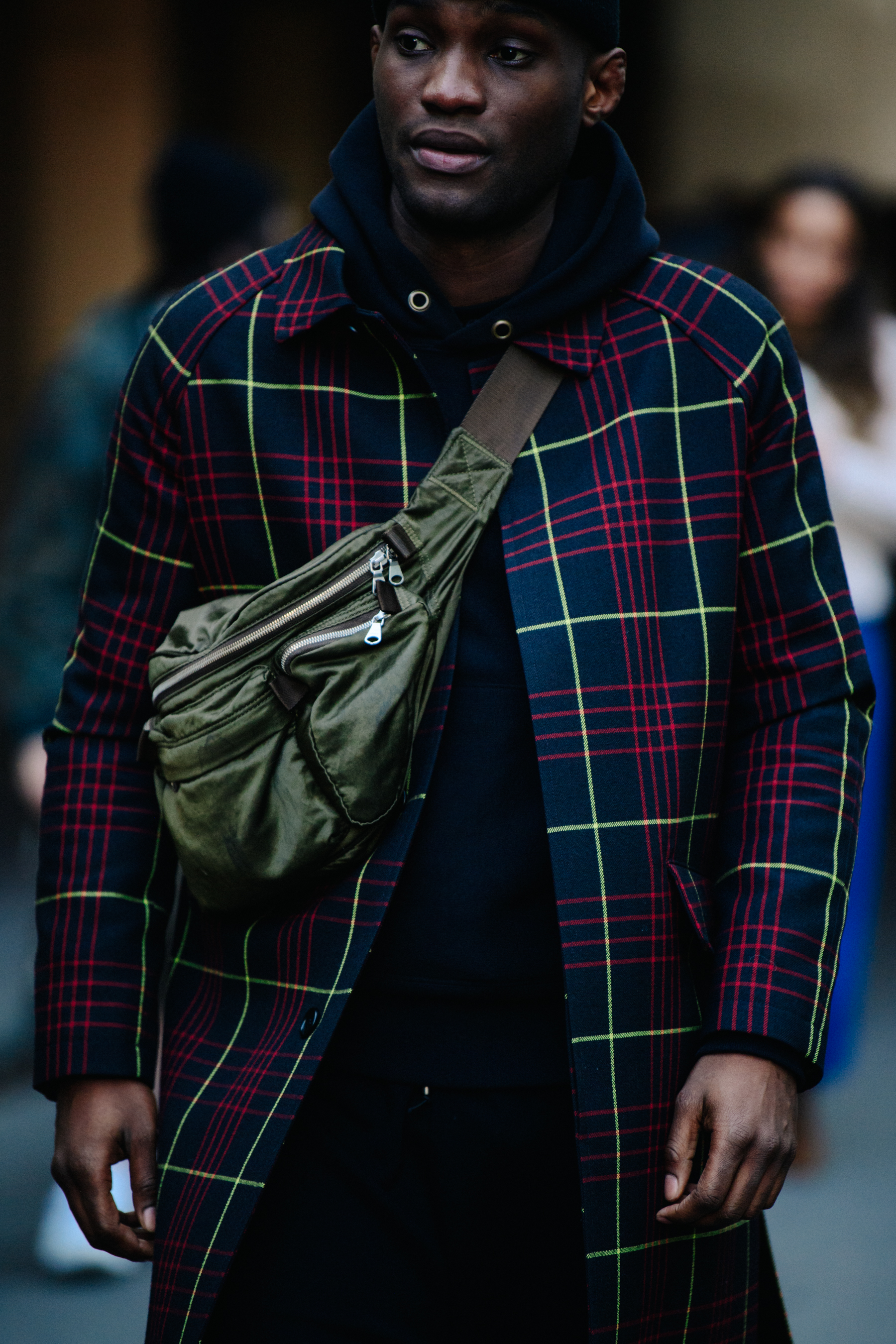 Man carrying green hip pack
