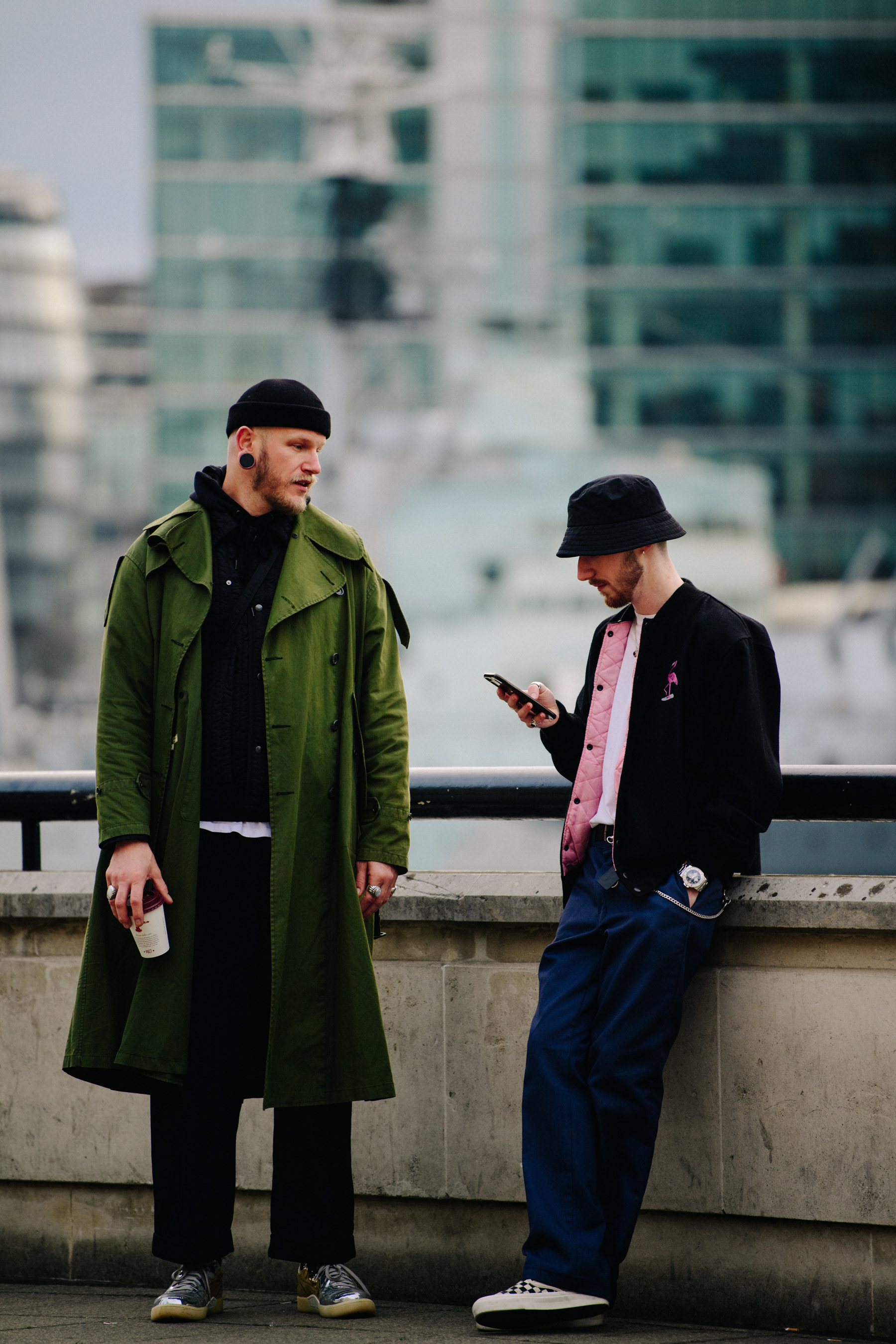 Two men wearing black hats