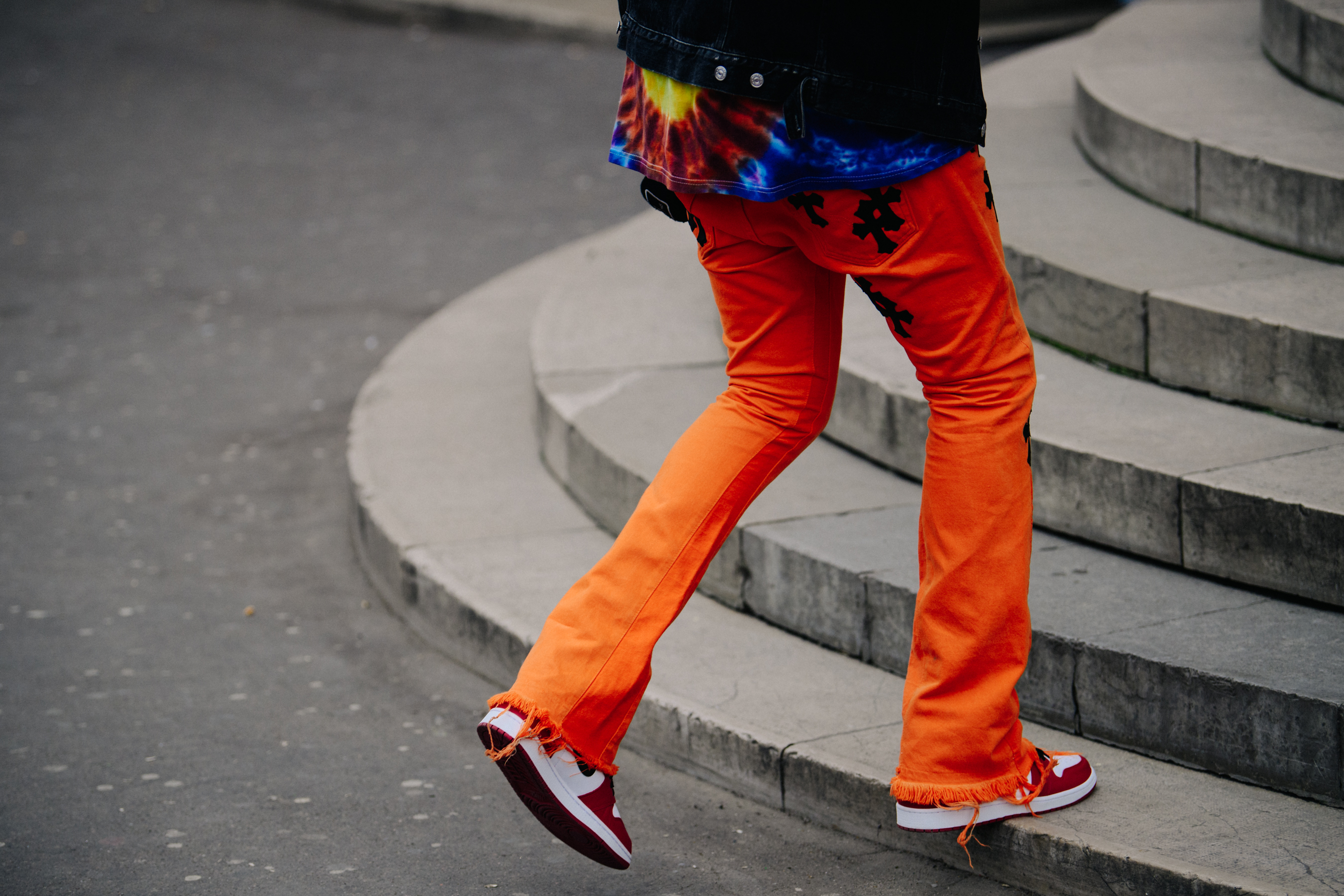 Man wearing orange jeans