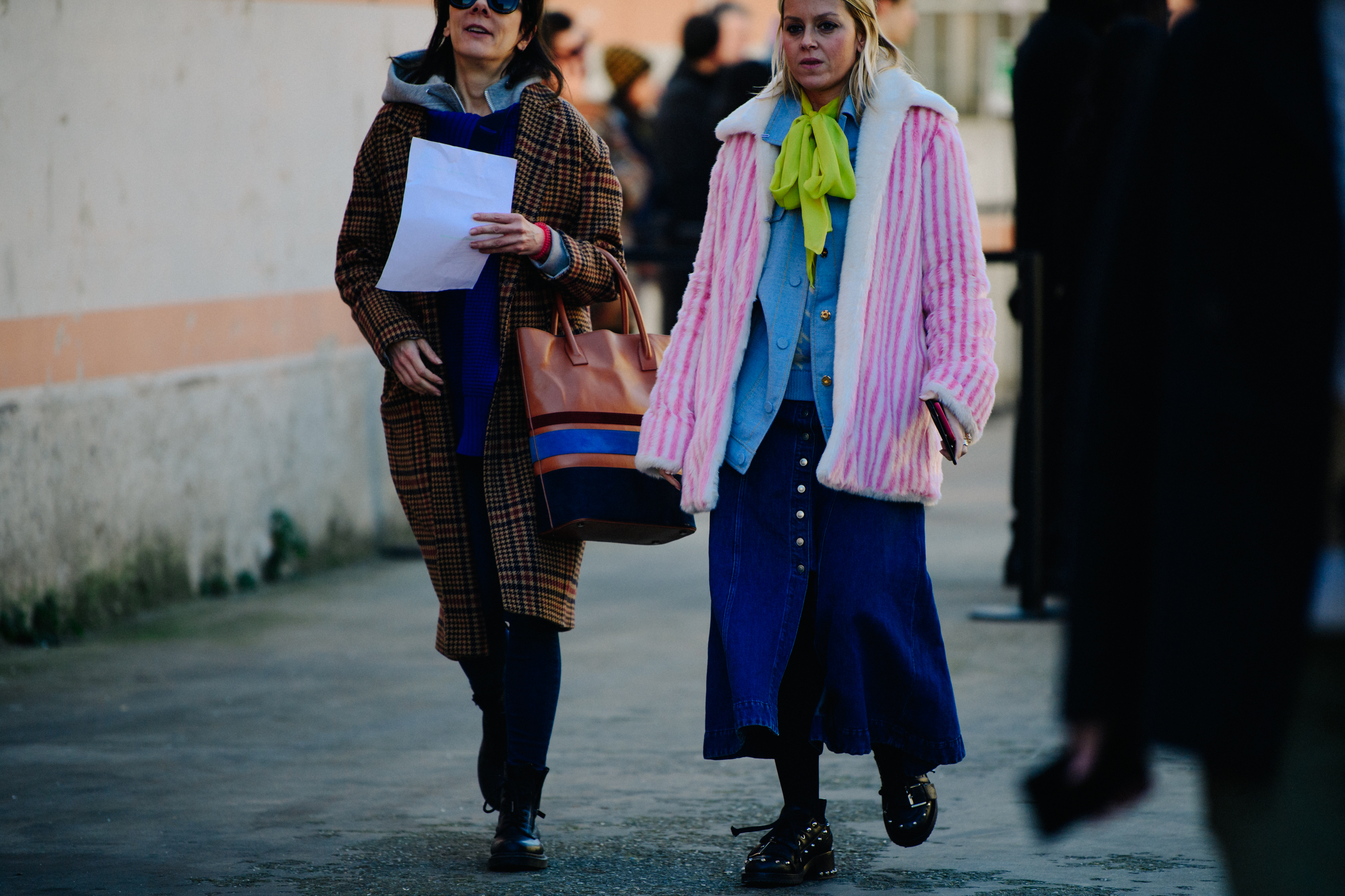 Two women wearing winter coats