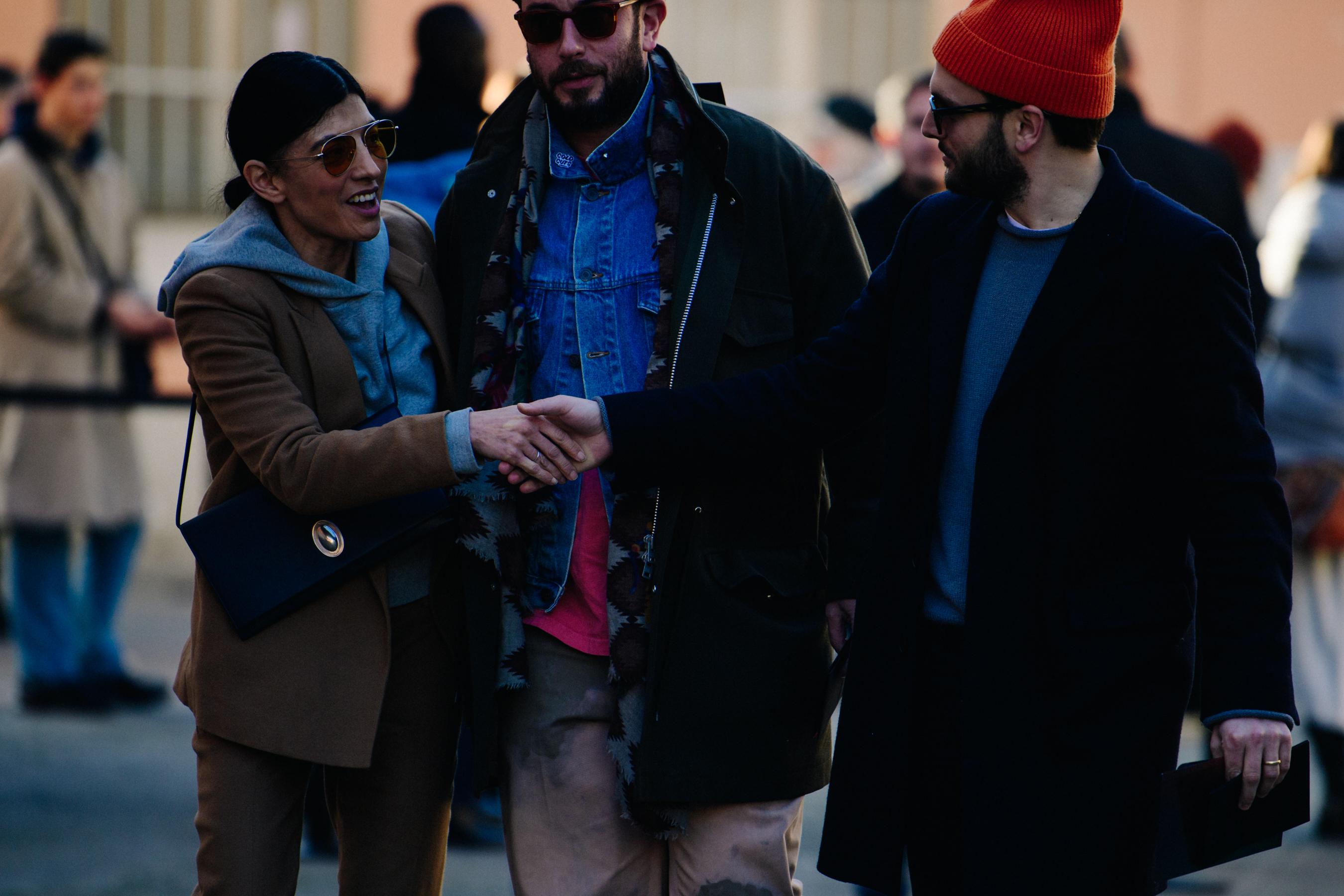 Three people wearing wool coats