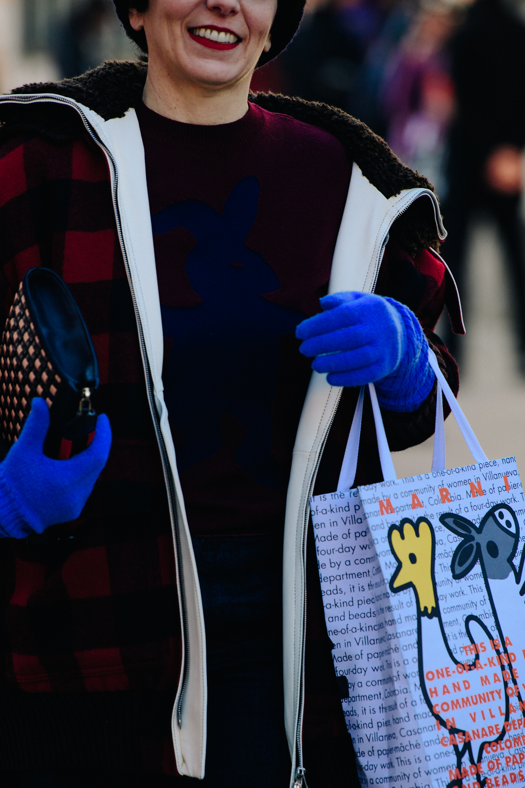 Woman wearing blue gloves