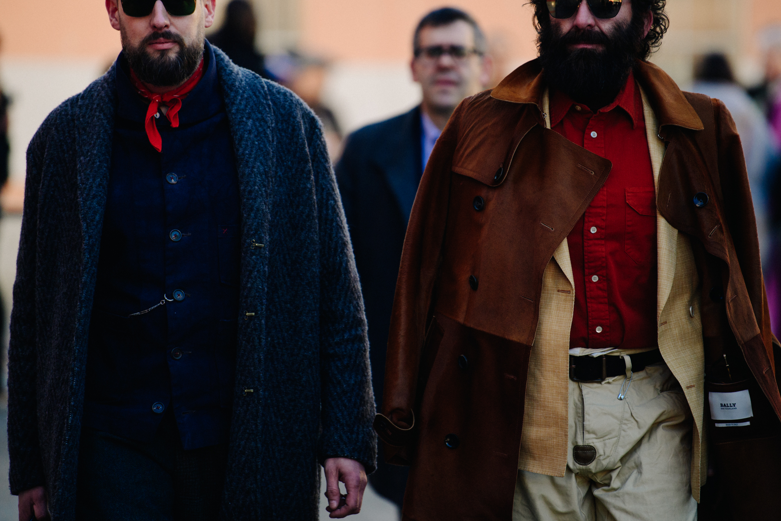 Two men wearing blue and red