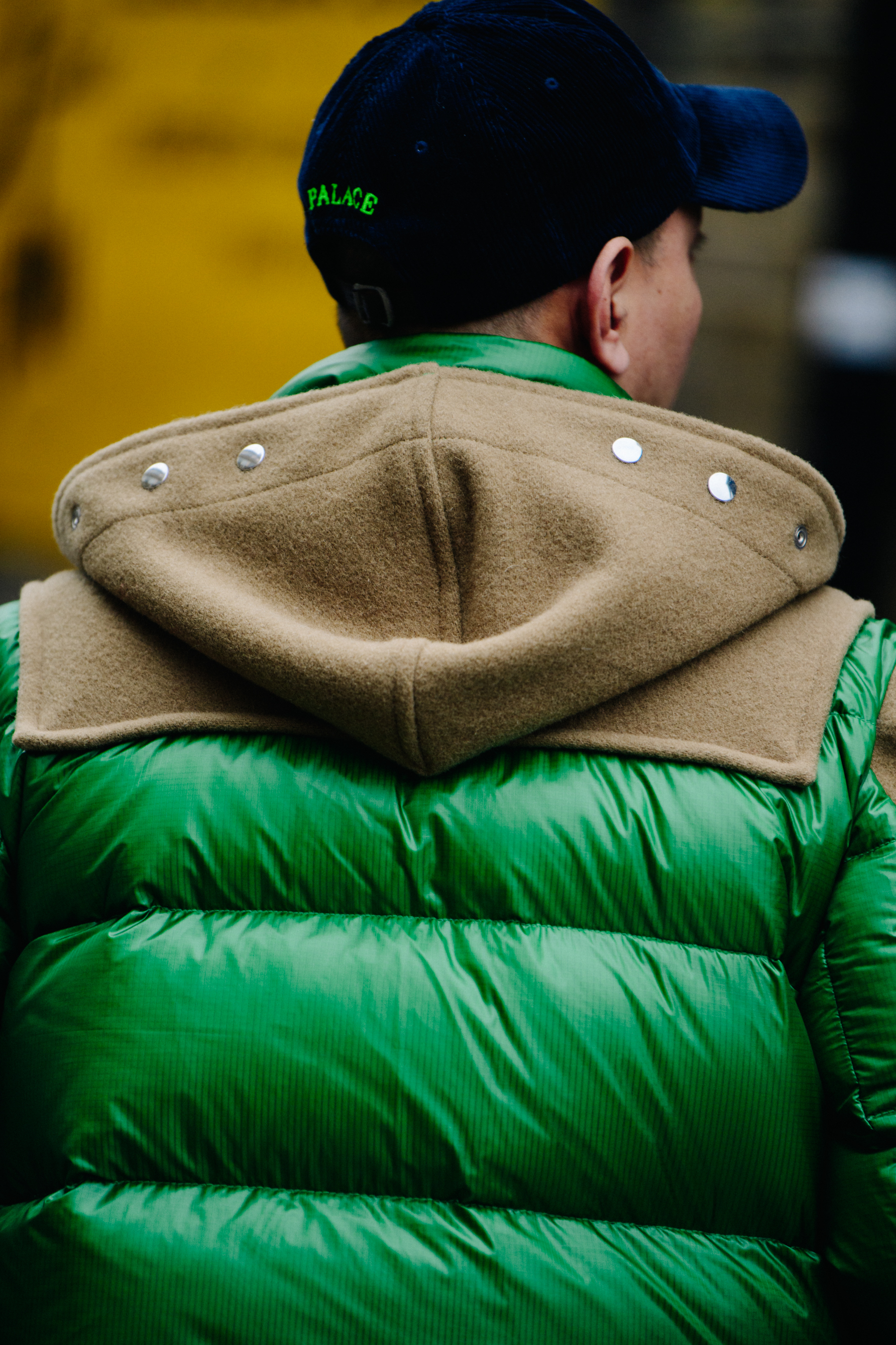 Man wearing green puffer coat