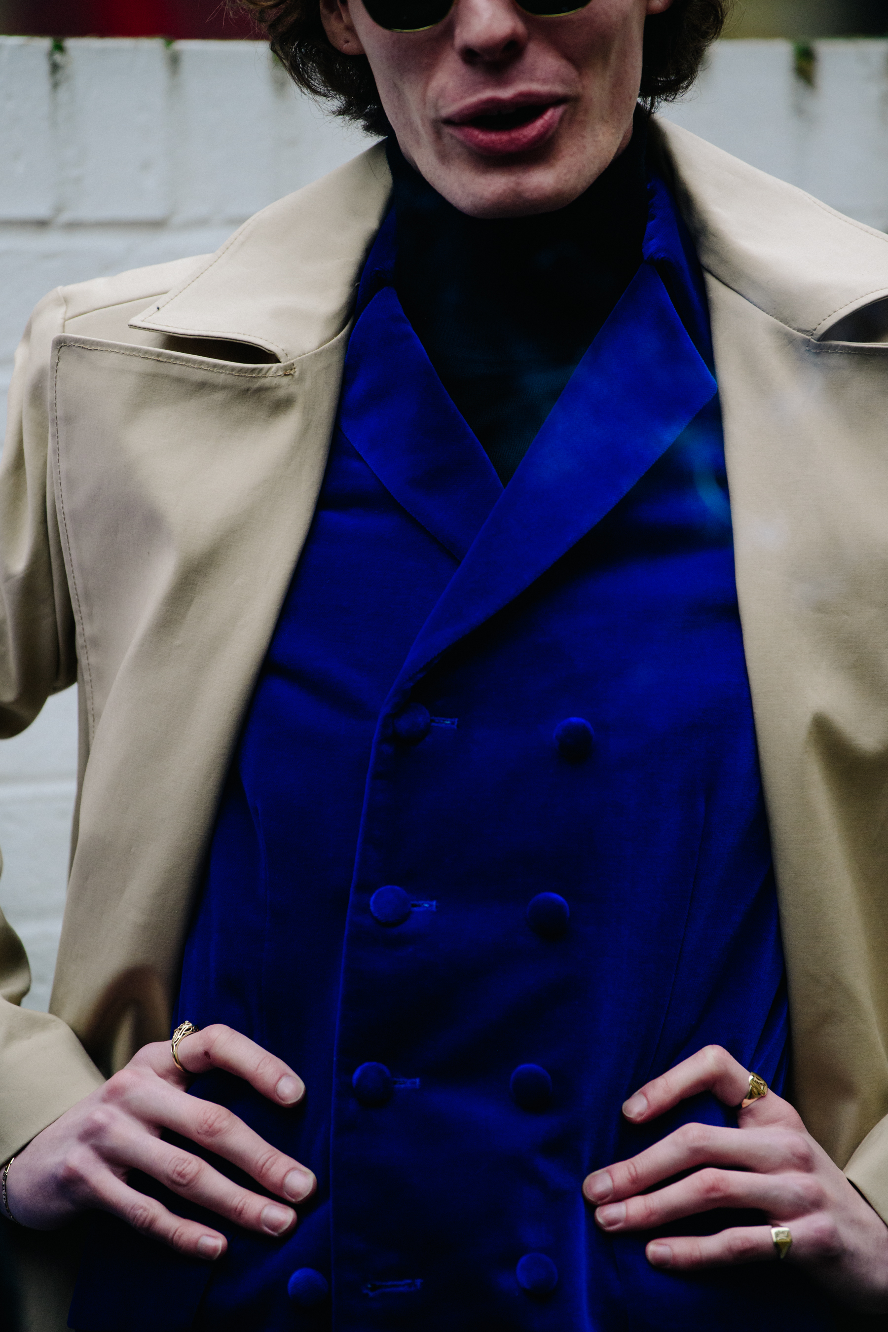 Man wearing blue vest