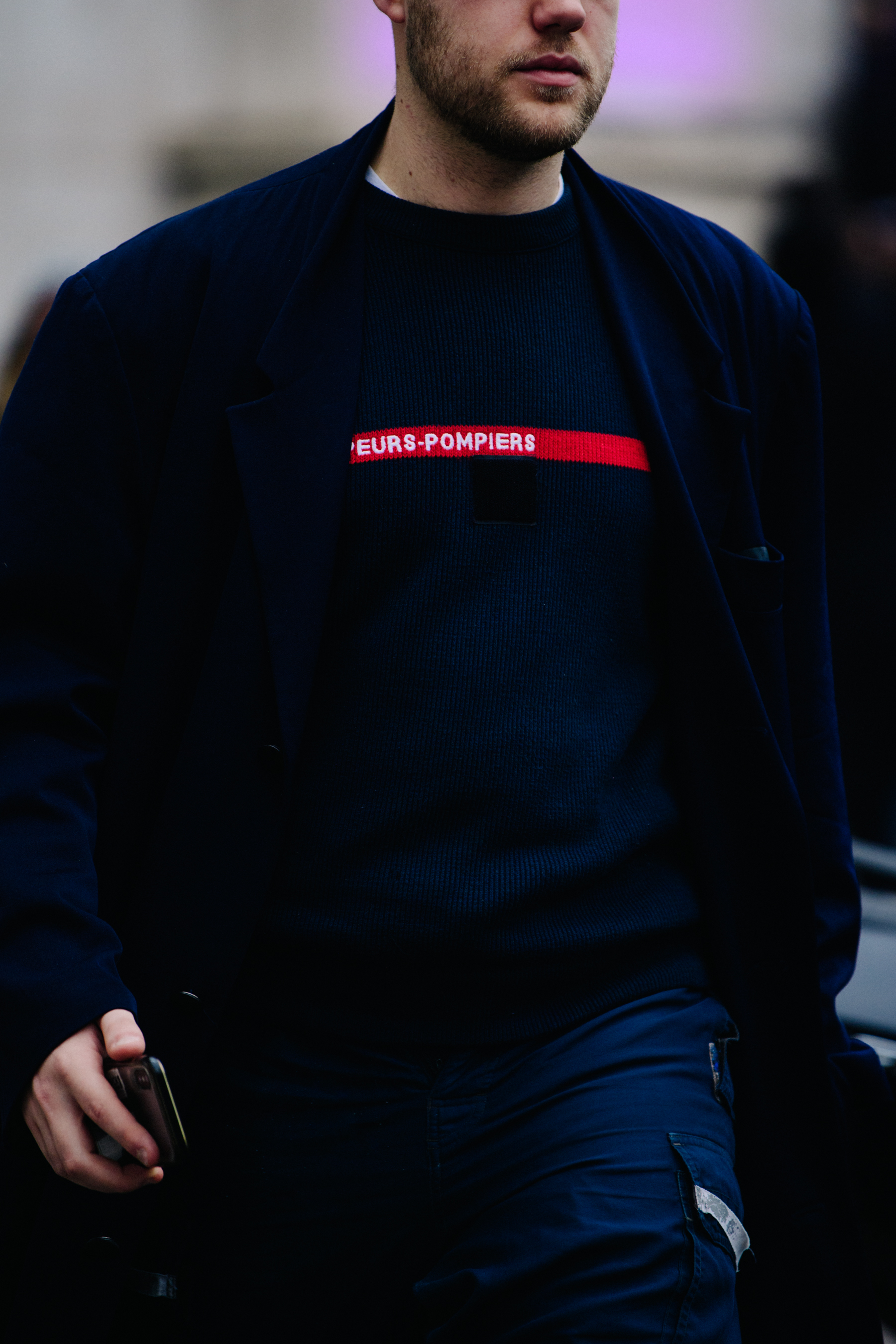 Man wearing blue jumper