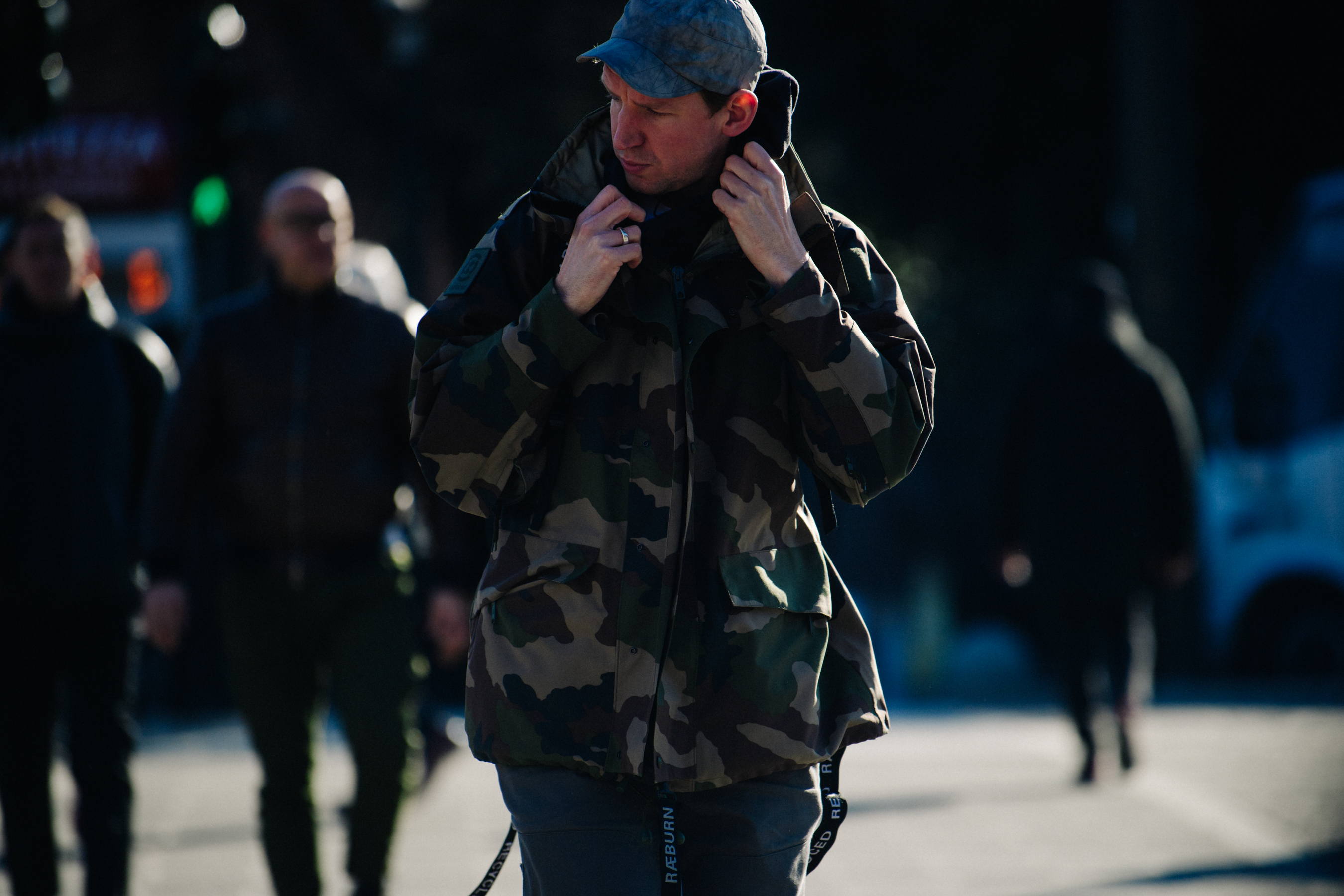 Designer wearing camo jacket