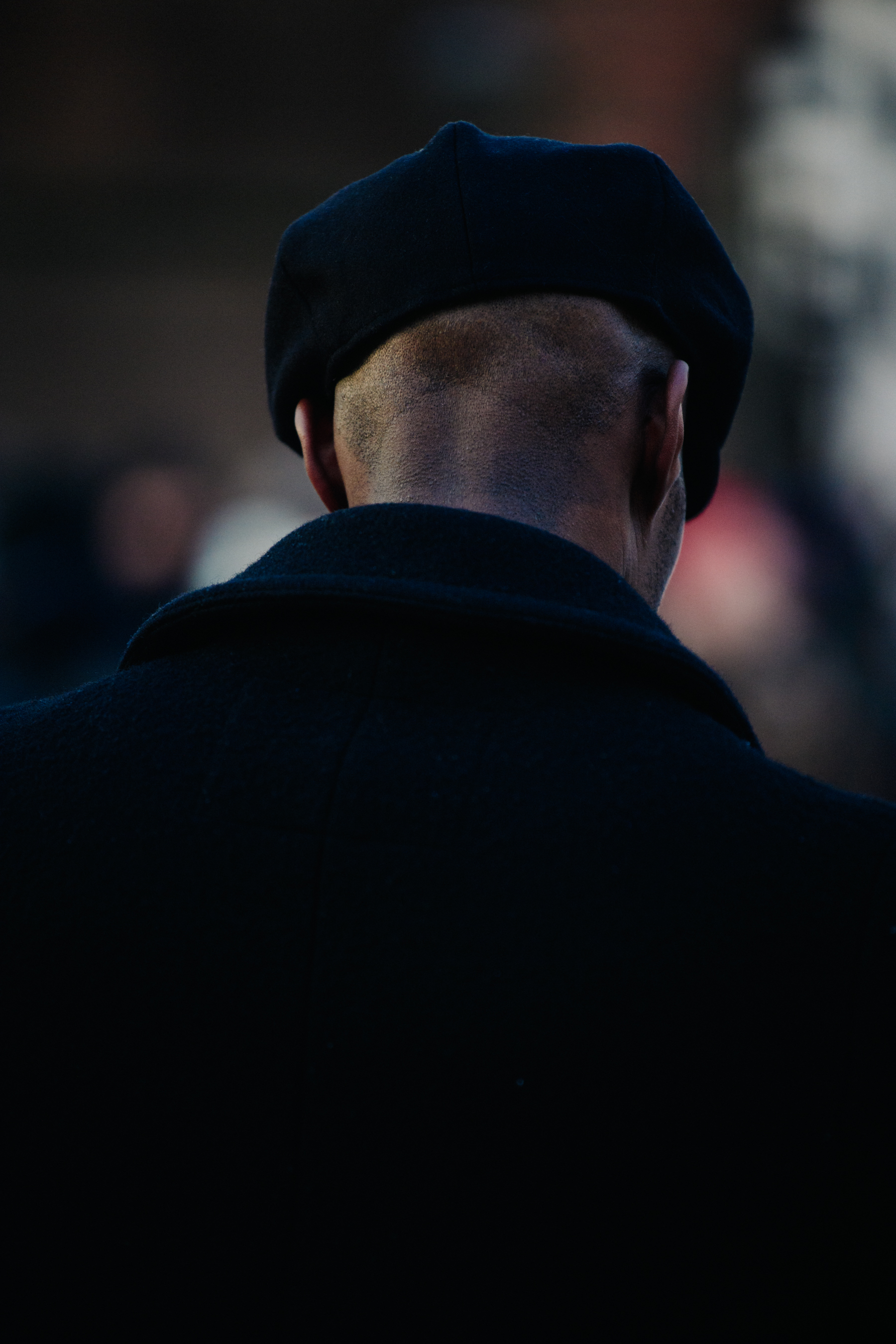 British man wearing dark hat